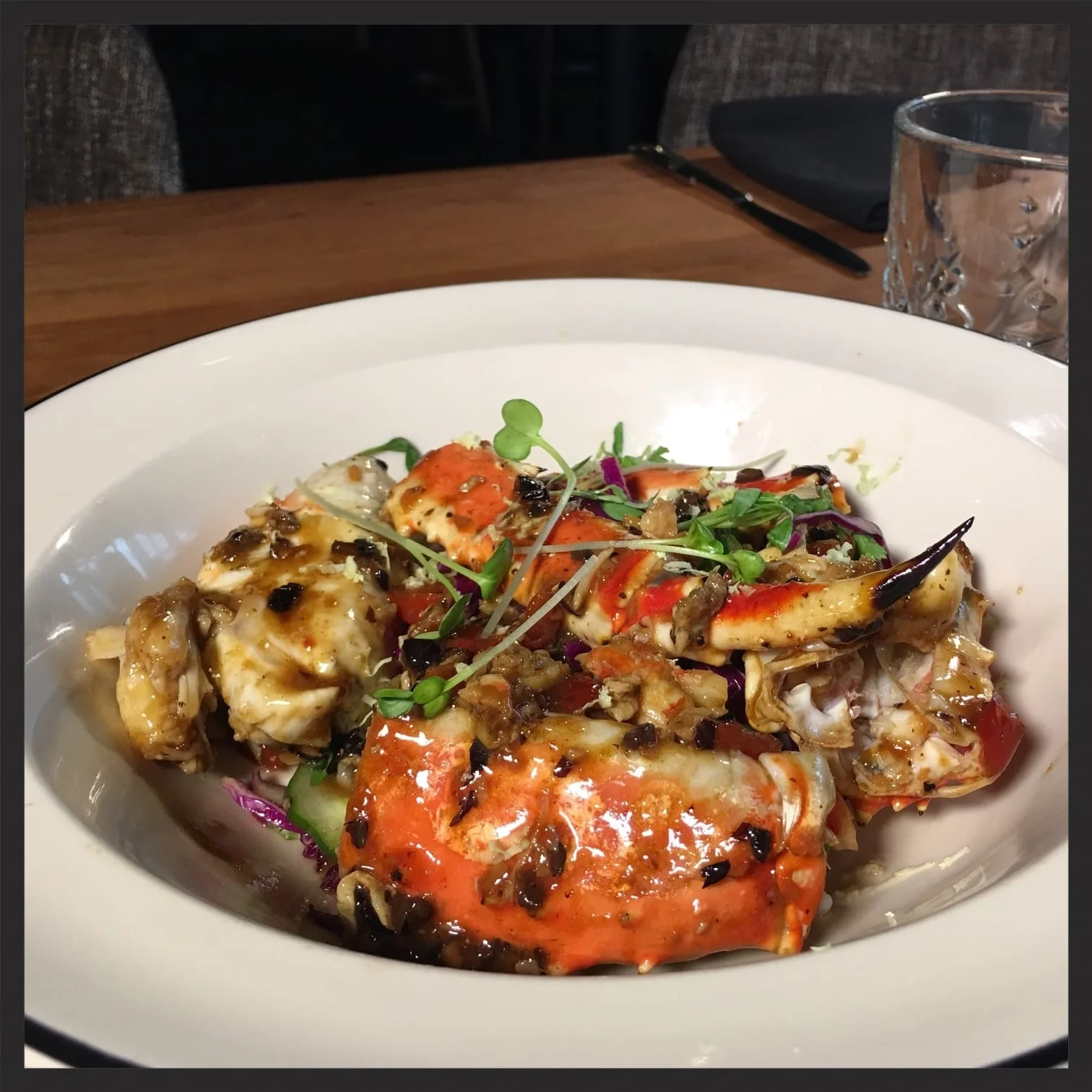 Wok-seared King Crab atop a cucumber salad with black bean sauce | Foodable WebTV Network