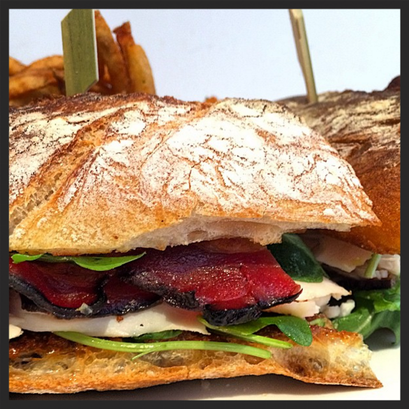 House roasted turkey sandwich with applewood smoked bacon, arugula, jalapeños at ABC Kitchen | Instagram @abckitchen