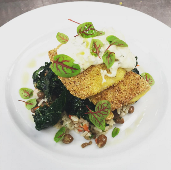 Cornmeal crusted speckled trout with Hoppin' John, sautéed kale and a pickled okra and jalapeño tartar sauce | Instagram @angeline_nola