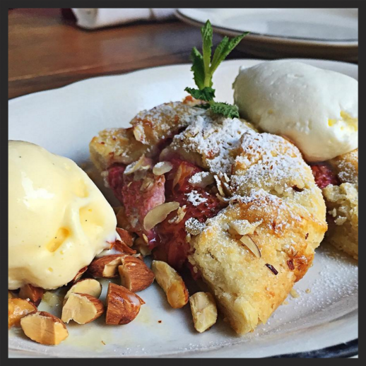 Strawberry frangipane crostata topped with toasted almonds and house-made corn ice cream | Instagram @michaelsgenuine