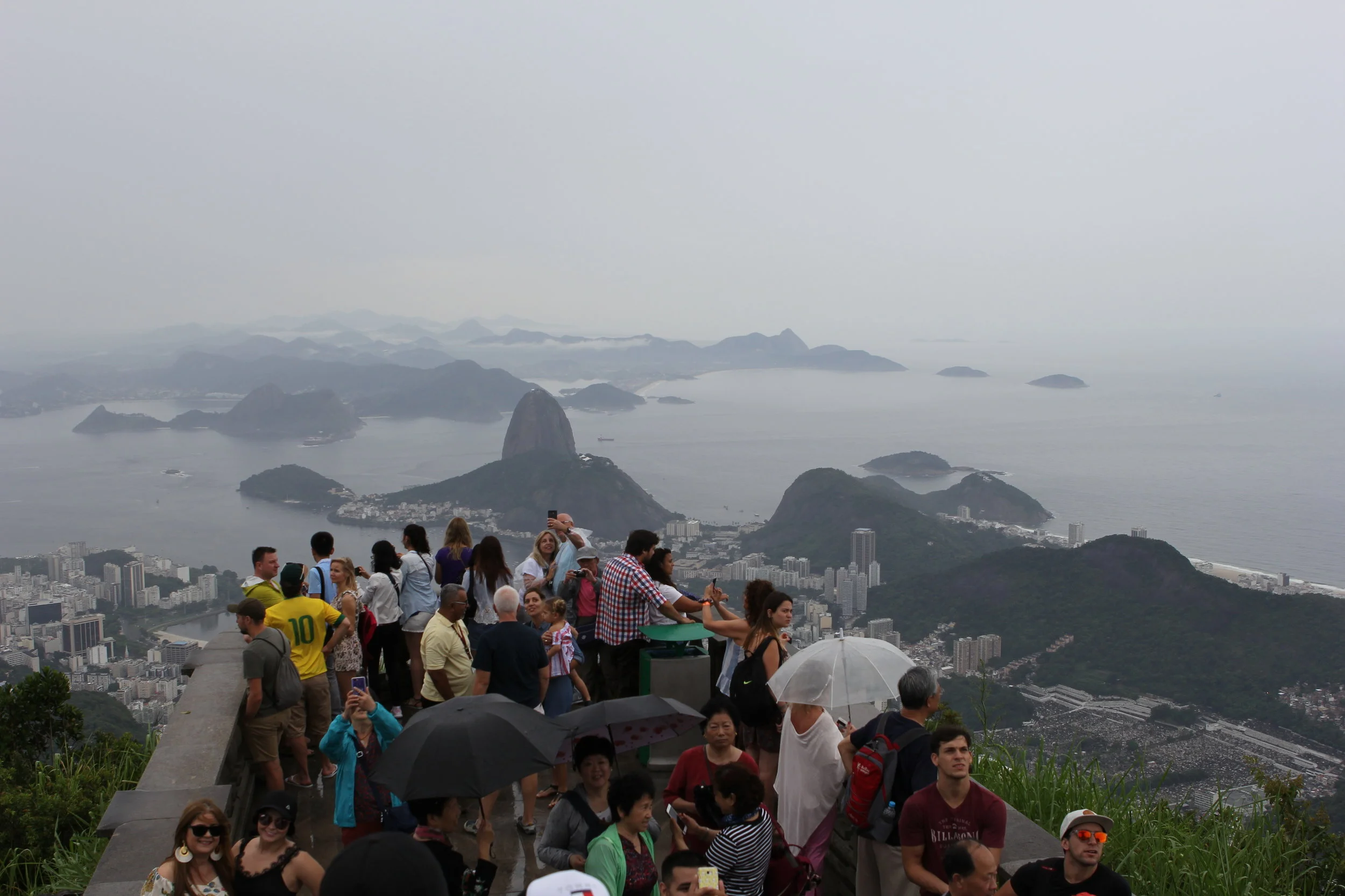Tourists take in view of Christ the Redeemer, Rio, Brazil