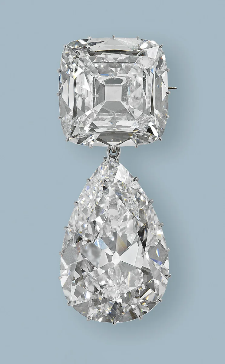 Cullinan diamond III and IV Brooch: The third and fourth largest of the Cullinan gems - a pear-shaped drop of 94.4 carats (III) and the cushion-shaped 63.3 carat IV - were originally placed by Queen Mary on her new crown in 1911. The stones were most often worn hooked together as a pendant brooch.