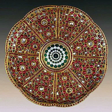 Highly detailed plate. 17th century, Mughal India. Gold, kundan setting technique, uncut diamonds, rubies, emeralds and enamel. Presented by the ambassadorial mission of Iranian ruler Nadir-Shah to the Russian Imperial Court, 1741. Photo: State Hermitage Museum.