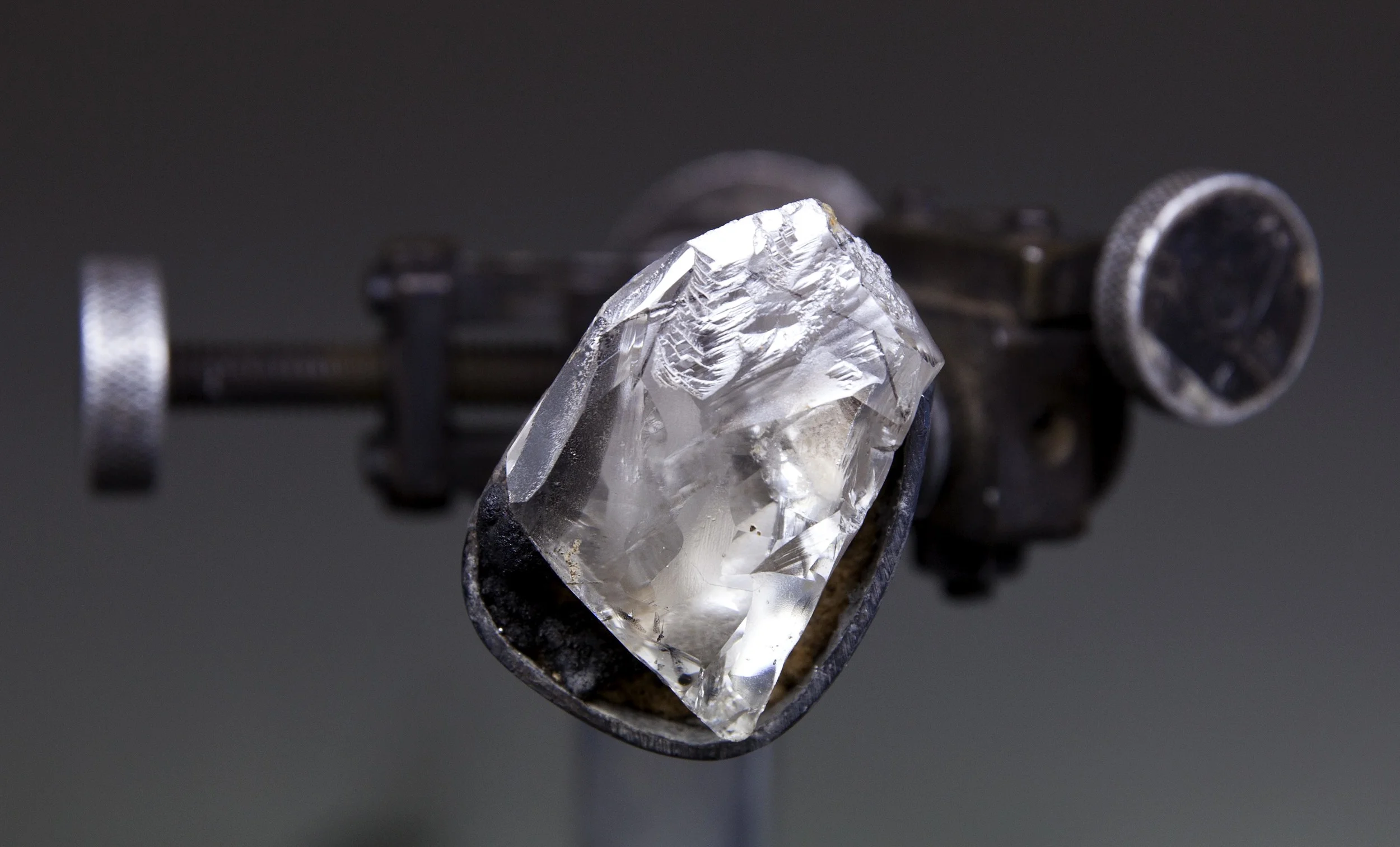 The 100.20-carat "Perfect" diamond during the cutting and polishing process. The original rough weighed more than 200 carats and was mined by De Beers in southern Africa. It took more than a year to study, cut and polish the rough into the 100-carat diamond. Photo courtesy: Sotheby's
