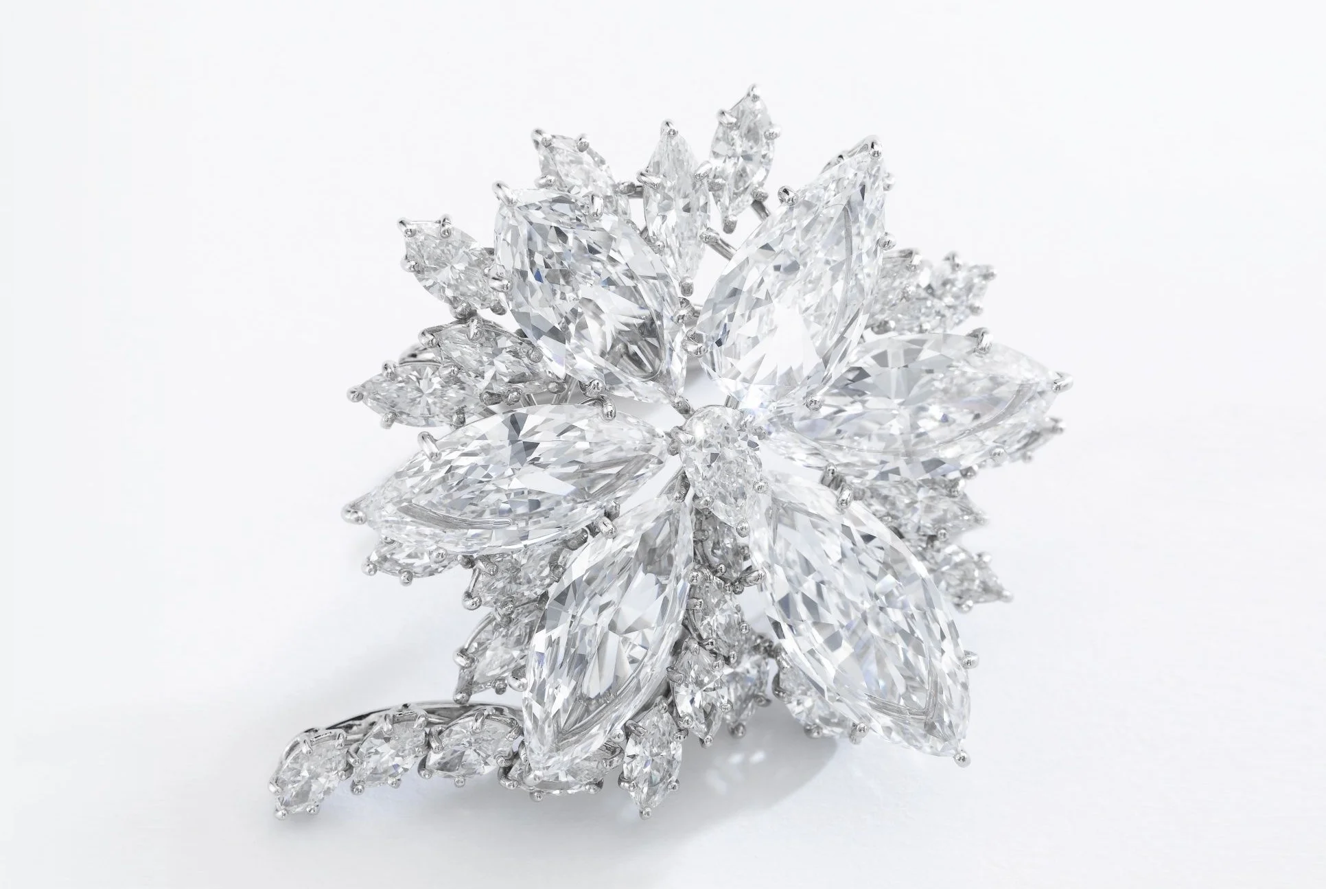 'The Star of Sierra Leone Diamond Brooch', Harry Winston. Of floral motif, set with a pear-shaped diamond, surrounded with a similarly shaped stone weighing 3.25 carats, and five marquise-shaped diamonds weighing 2.86, 2.97, 3.74, 3.93 and 4.30 carats, further highlighted with marquise-shaped stones, unsigned, maker's mark for Jacques Timey. Image: Sotheby's