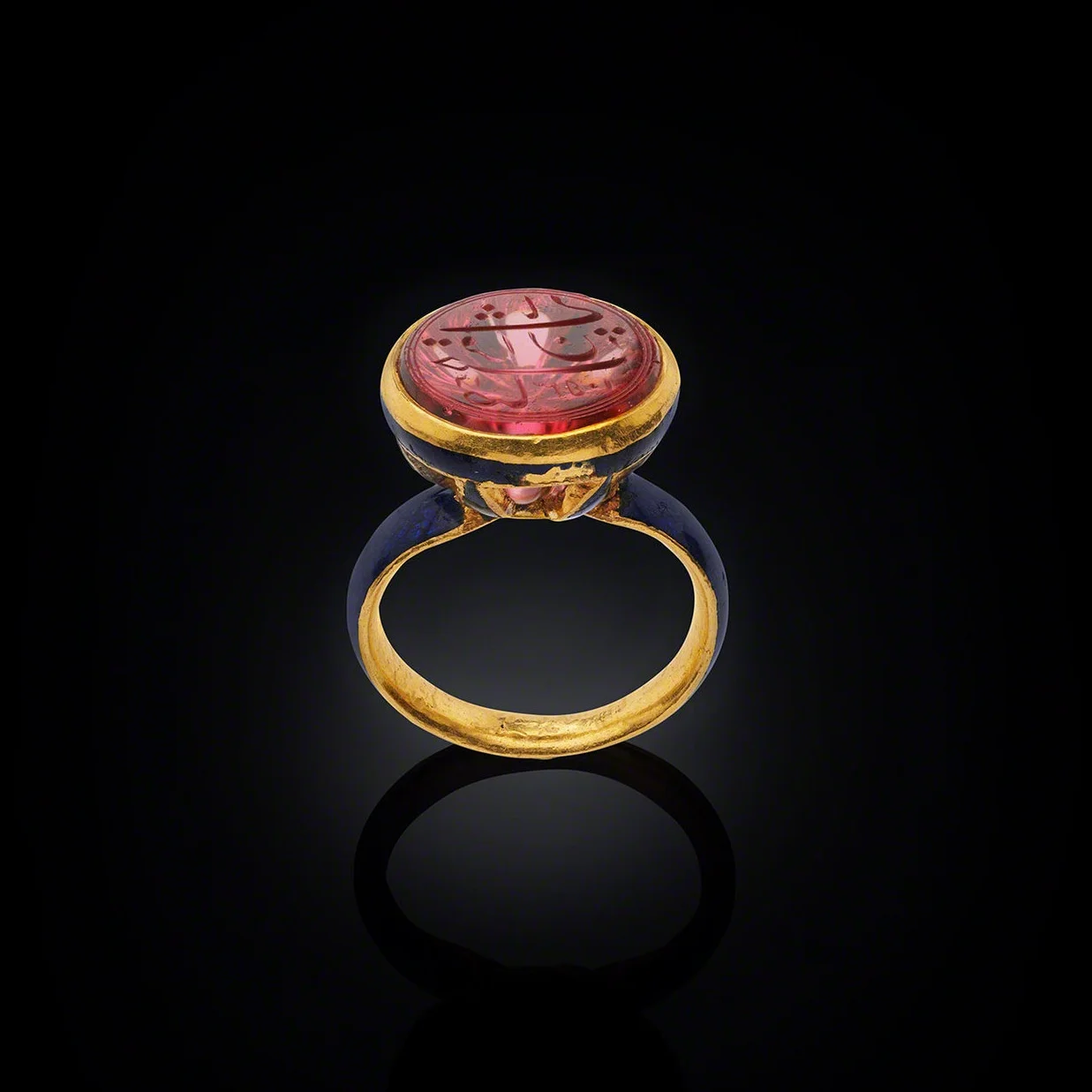 Ring with Shah Jahan’s Spinel North India, the spinel dated AH 1053 (AD 1643– 44); the ring, c. 1900Gold with enamel, the spinel inscribed in Persian: Sahib qiran-i thani (“Second Lord of the Auspicious Conjunction”) Dating from 1643, this spinel is engraved on the reverse “Sahib qiran-I thani” which translates as “Second Lord of the Auspicious Conjunction”, the title of Emperor Shah Jahan who ruled 1628 - 1658. The title was chosen by Shah Jahan himself in reference to Timur (Tamerlane), the Mughals’ dynastic ancestor, who bore the title “Lord of the Auspicious Conjunction”. It is most likely that the engraving on the spinel was also the sovereign’s personal seal. Image courtesy: © The Al Thani Collection