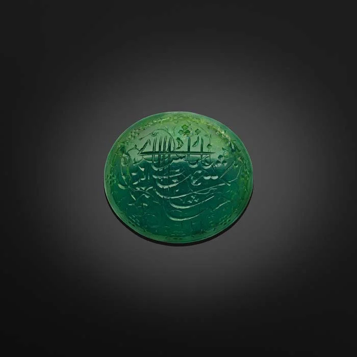 The Shah Jahan Emerald. North India or Deccan, dated AH 1031 (1621–22) Inscribed in Persian: Shihab al-din Muhammad Shah Jahan Padshah Ghazi 1031 (“Shihab al-din Muhammad Shah Jahan Ghazi Emperor 1031”). Usually adorned with pious formulas, Koranic verses or mystical sayings, emeralds – unlike spinels or balas rubies often inscribed with royal titles – were rarely engraved with the names of the sovereigns who owned them, hence the singularity of this cabochon-cut emerald bearing the name of Shah Jahan. Image courtesy: Al Thani Collection