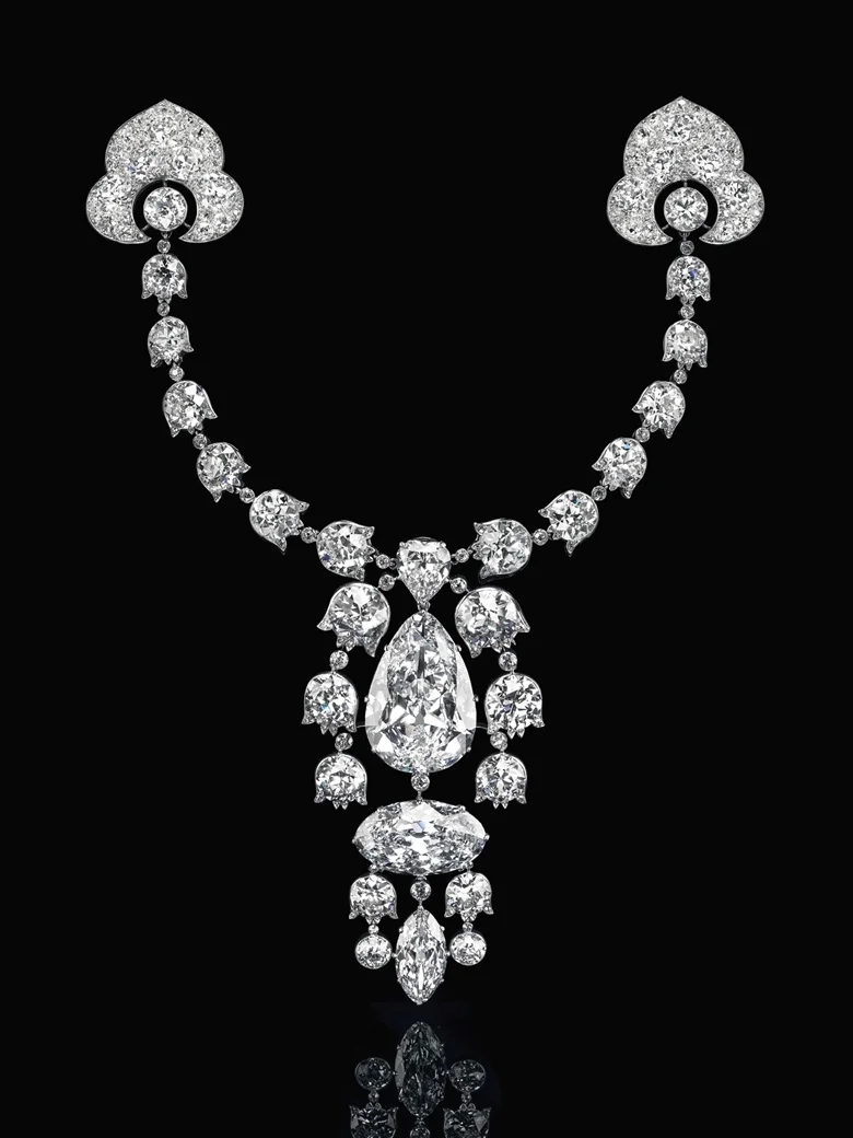 Devant-de-Corsage brooch, 1912, Cartier. Pear brilliant-cut diamond of 34.08 carats, oval brilliant-cut diamond of 23.55 carats, modified marquise brilliant-cut diamond of 6.51 carats, heart modified brilliant-cut diamond of 3.54 carats, lily-of-the-valley old-cut diamond links, platinum and 18k white gold. Image: Christie’s
