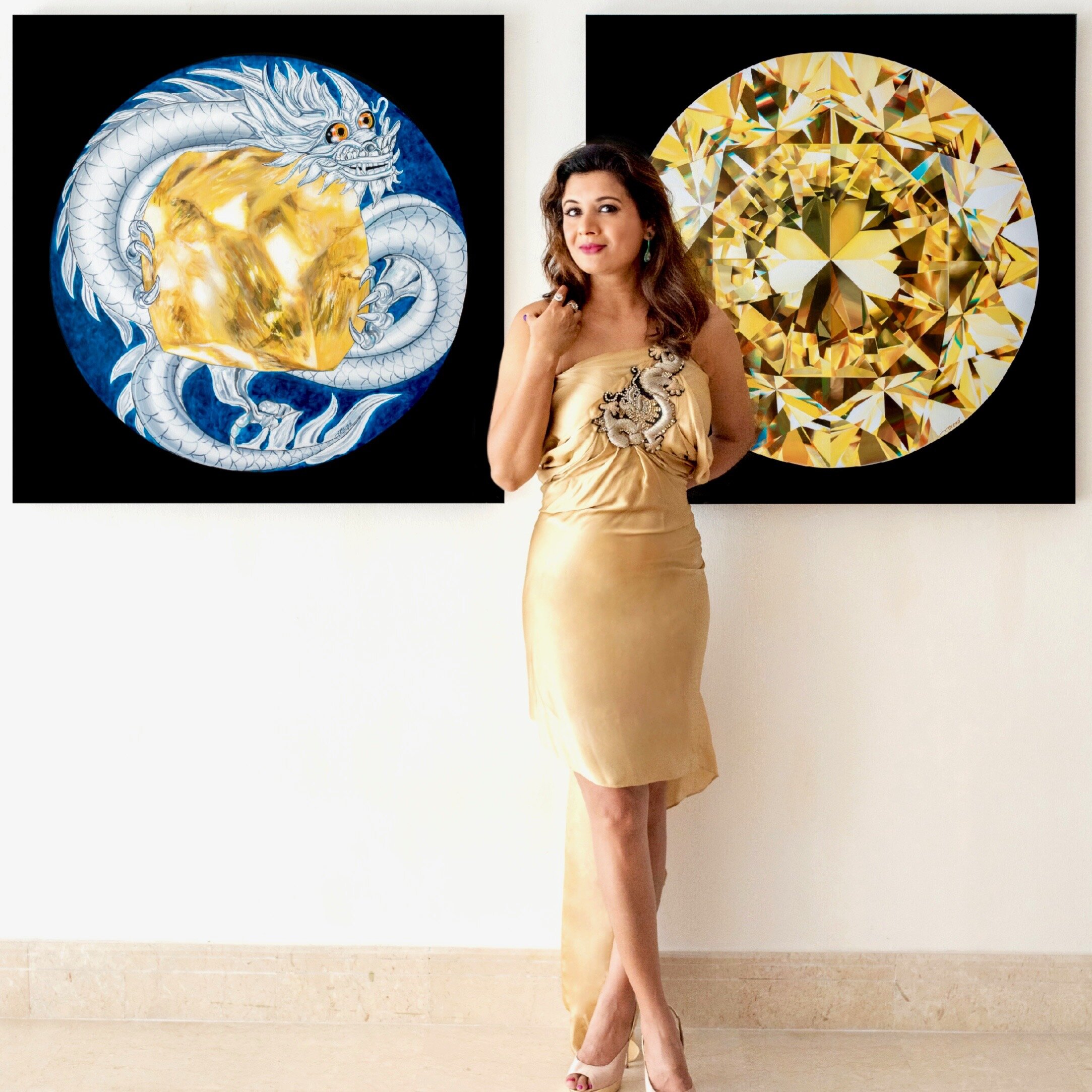 Reena Ahluwalia with her Mouawad Dragon rough and polished diamond paintings.  