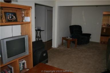 This is a shot of the other side of the living room, originally meant as the dining room. We turned it into an office/piano area.