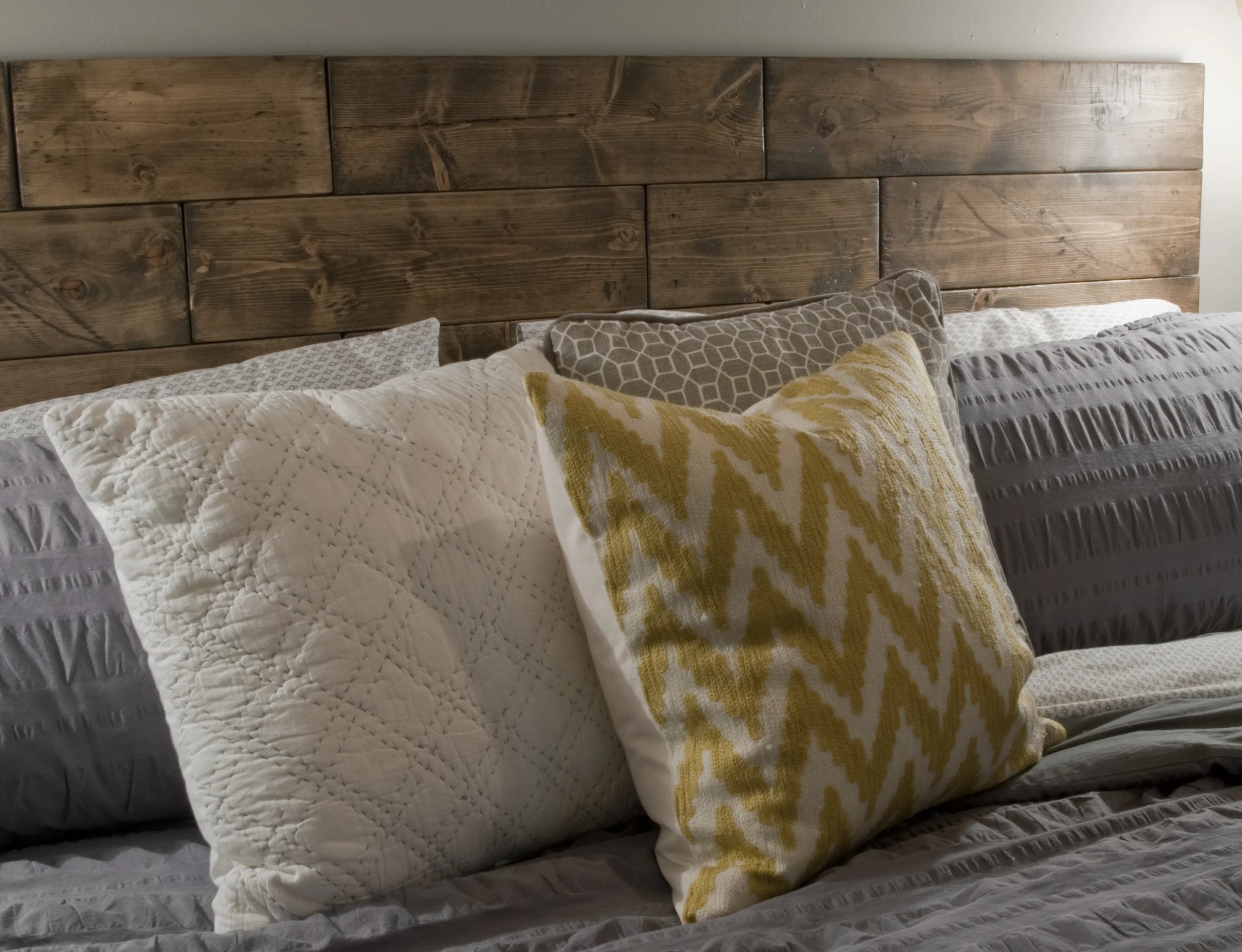 I will do a separate post on this, but here is my faux reclaimed lumber headboard. This was sort of the crown jewel of the whole project for me. It was a really fun challenge, and I can't wait to share more of the process.
