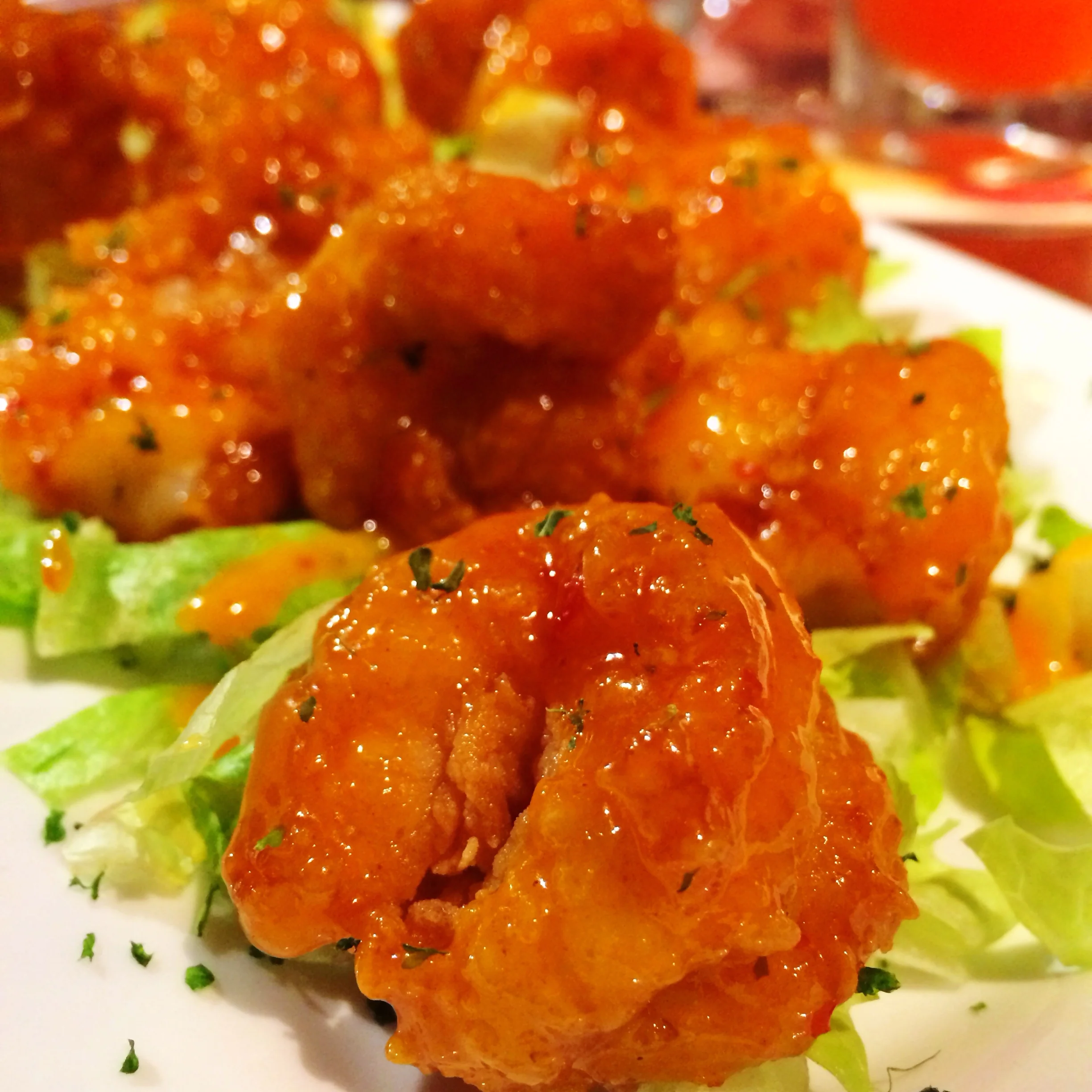 Sweet Chili Shrimp A dozen hand-battered shrimp tossed in a spicy chili sauce