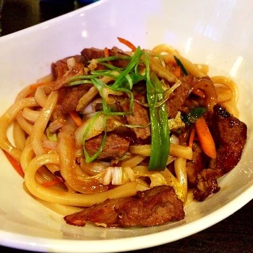 Japanese thick rice noodles sauteed in savory sauce with mix vegetables