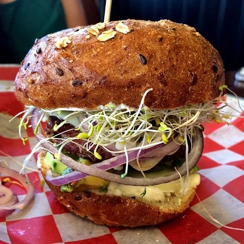 Turkey Burger (@thatonespot) fresh sprouts, cucumber, garlic aioli, avocado, American cheese