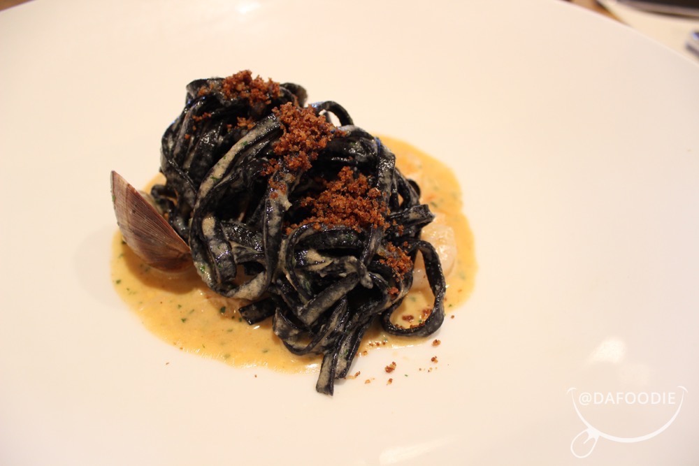 Squid Ink Linguini “Frutti Di Mare”. Calamari, jonah crab, rock shrimp, clams, uni mayo, charred pepper, tasso ham, pimenton crumbs.