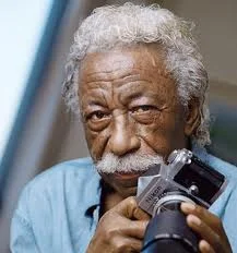 Gordon Parks with one of his favorite work tools and play things. His creative work with a camera permanently changed photo-journalism