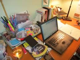 This could easily be my desk--covered with miscellaneous everything, light coming in from the right, and a candle on the left. Writers can be neat and orderly too, or like me, some of both.