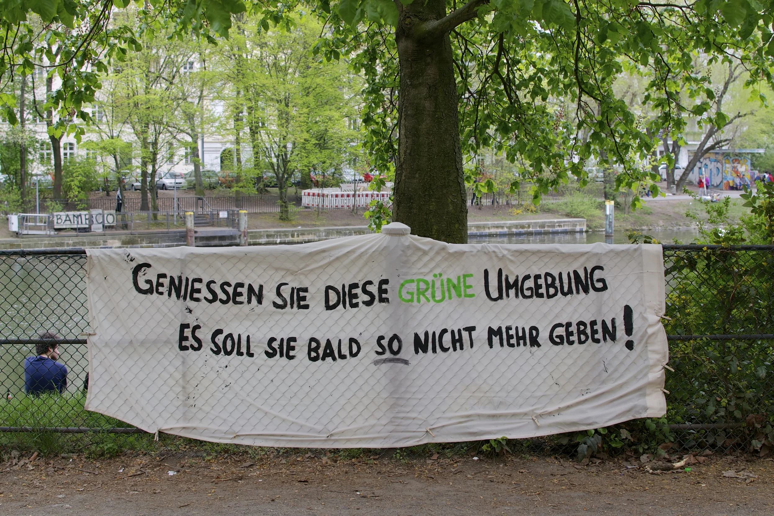"Enjoy these green surroundings. Soon they won't be like this anymore!" (seen in Kreuzberg)
