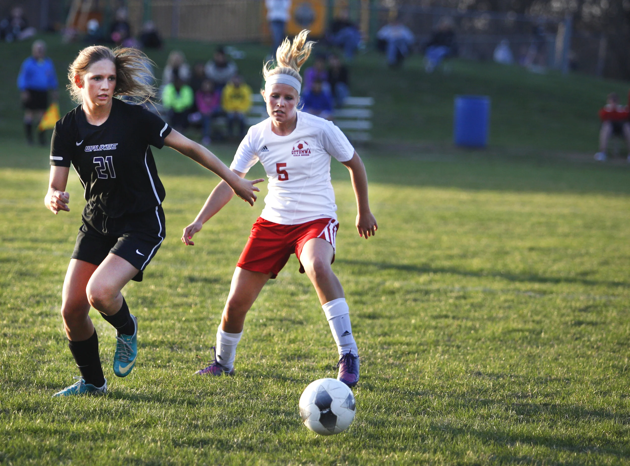   Junior player Daylin Latham fights for control of the ball Tuesday during the Ottumwa girls soccers game.  