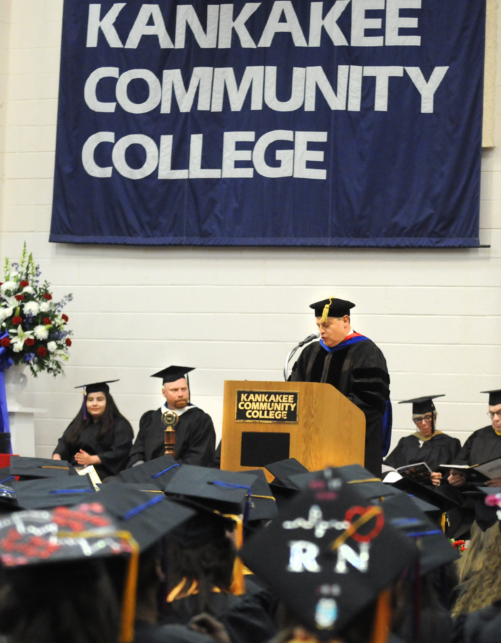  Kankakee Community College President, Dr. John Avendano, gives his welcoming speech during the commencement ceremony Saturday at Kankakee Community College. 