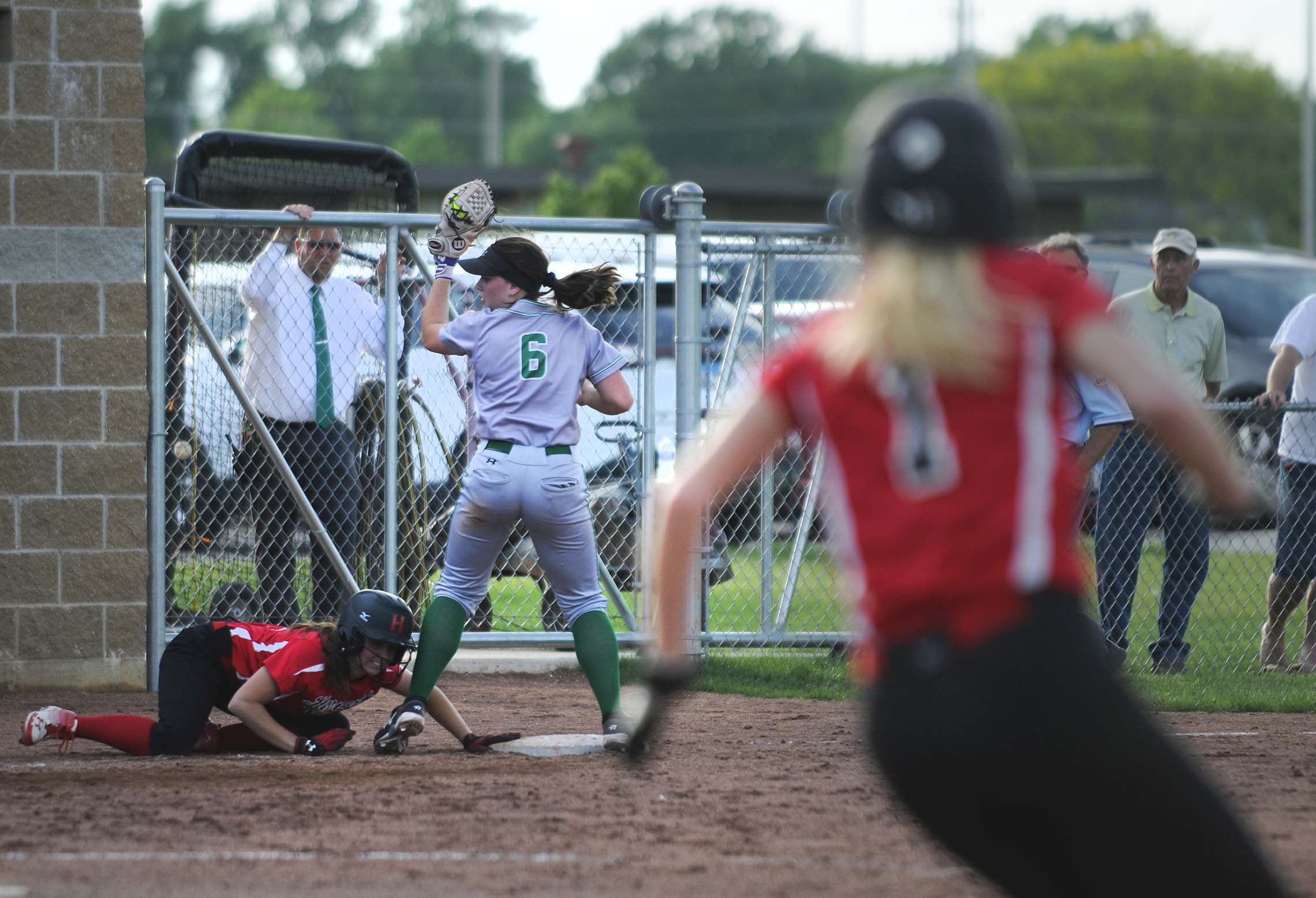  Dwight Township High School player Katy Edwards attempts to tag out a Hayworth player Tuesday during the Class 1A Sectional semifinal softball game at Dwight Township. 