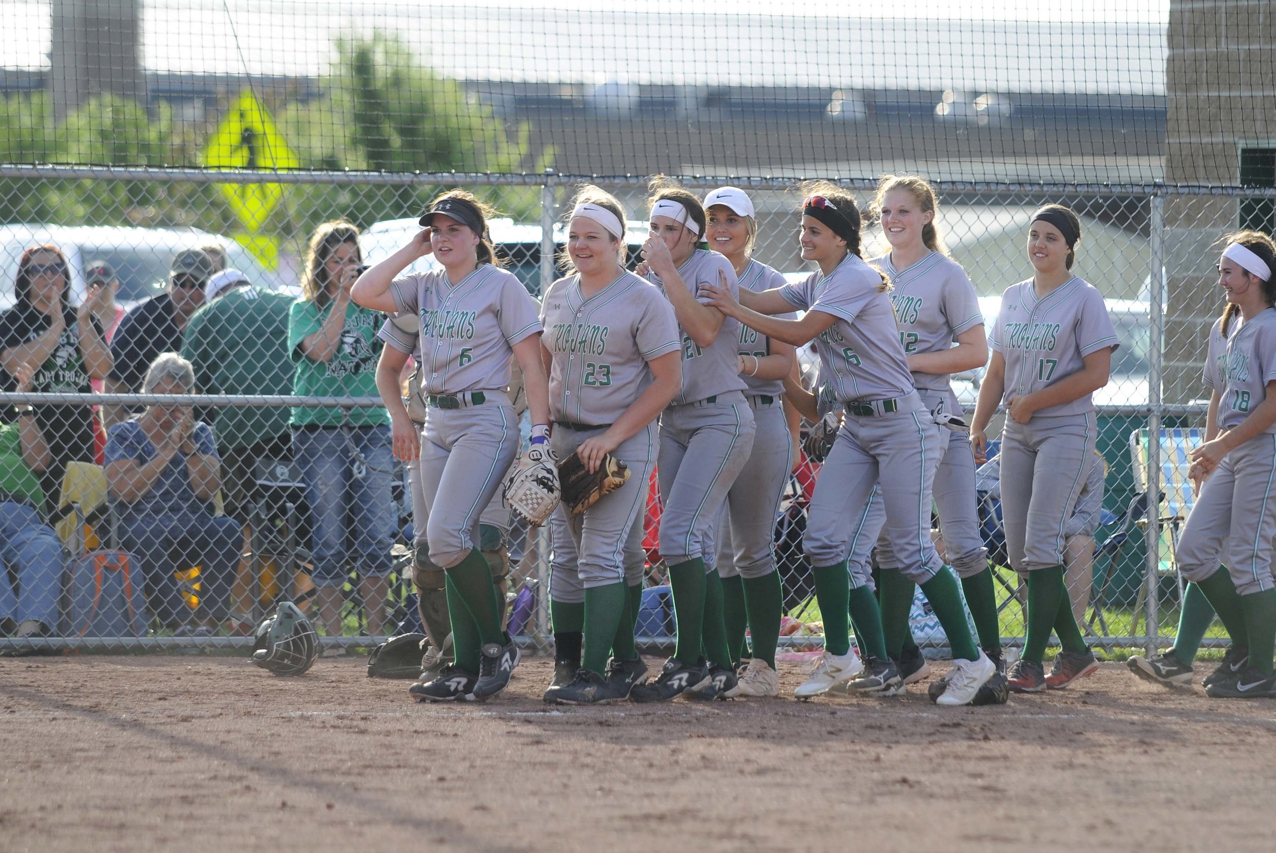  Dwight Township High School Lady Trojans join together on the field Tuesday after a 7-6 win against Hayworth. The team was nocked out of last years sectional title game by Hayworth, but now will be moving on to sectional championships.    