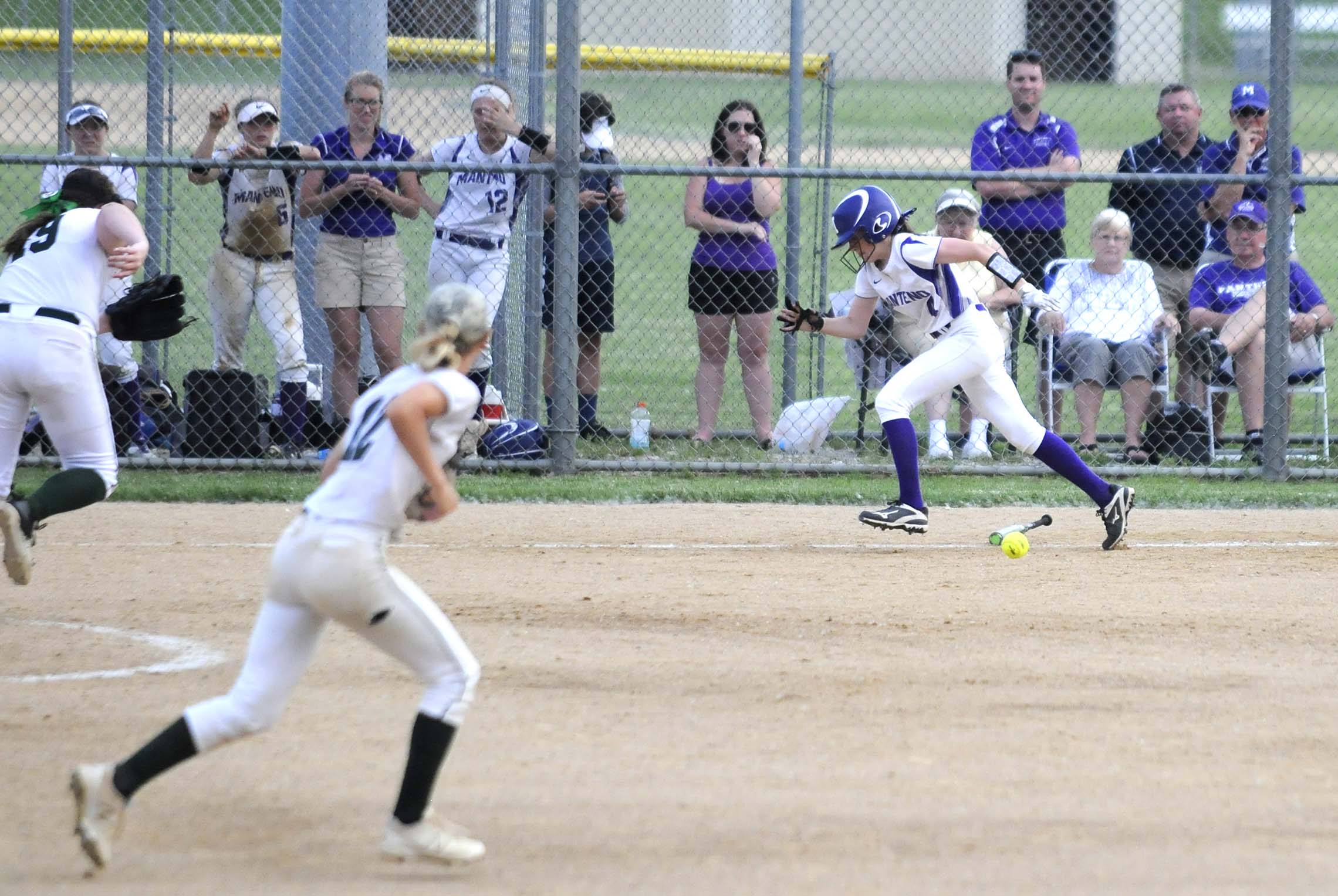  Manteno player Karlie Wenzel runs to first after a bunt hit Tuesday during a game against Providence Catholic.     