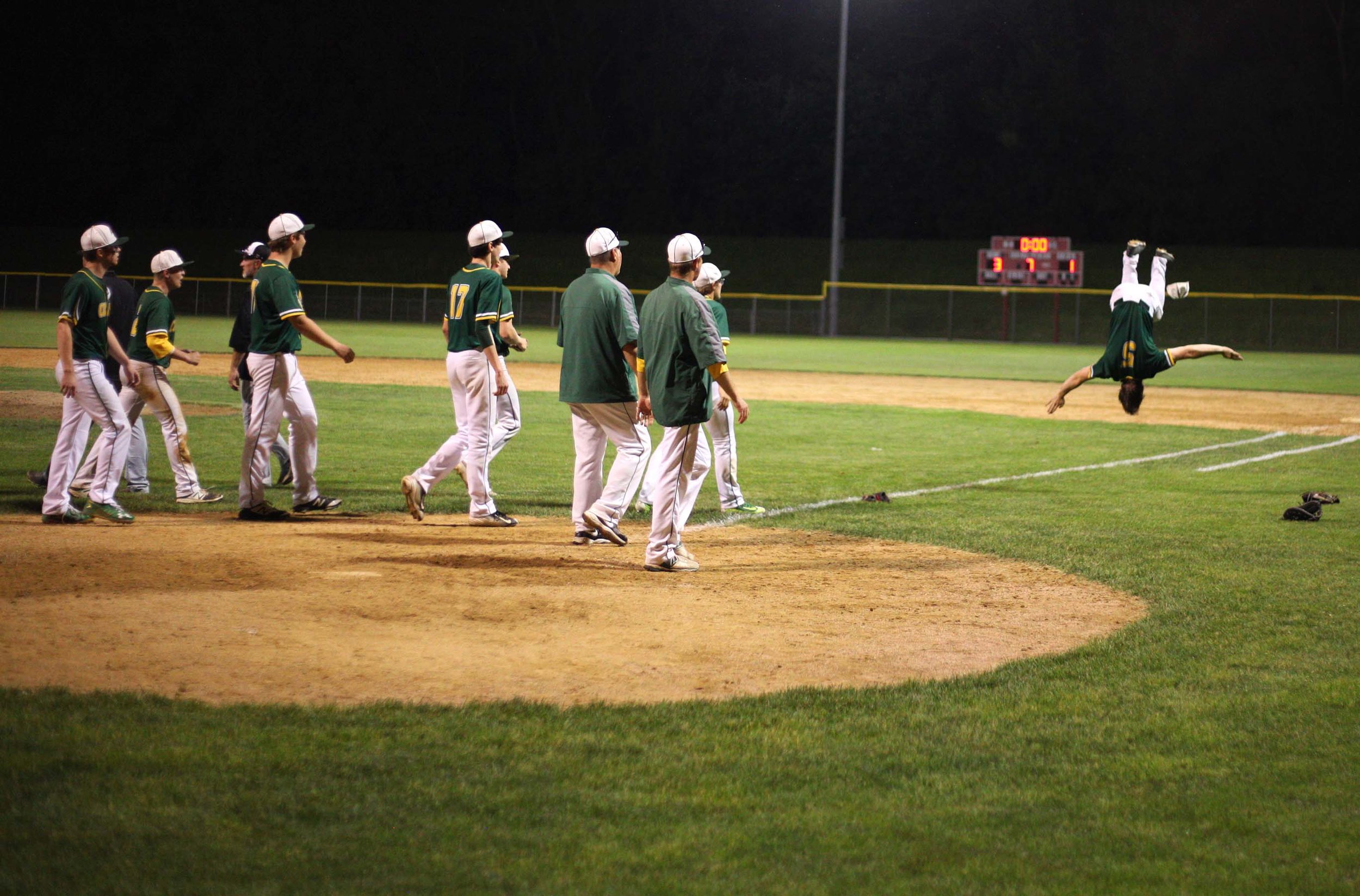  Coal City player Brendan Nevin celebrates with a flip Tuesday night after a victory over Illiana Christian.    
