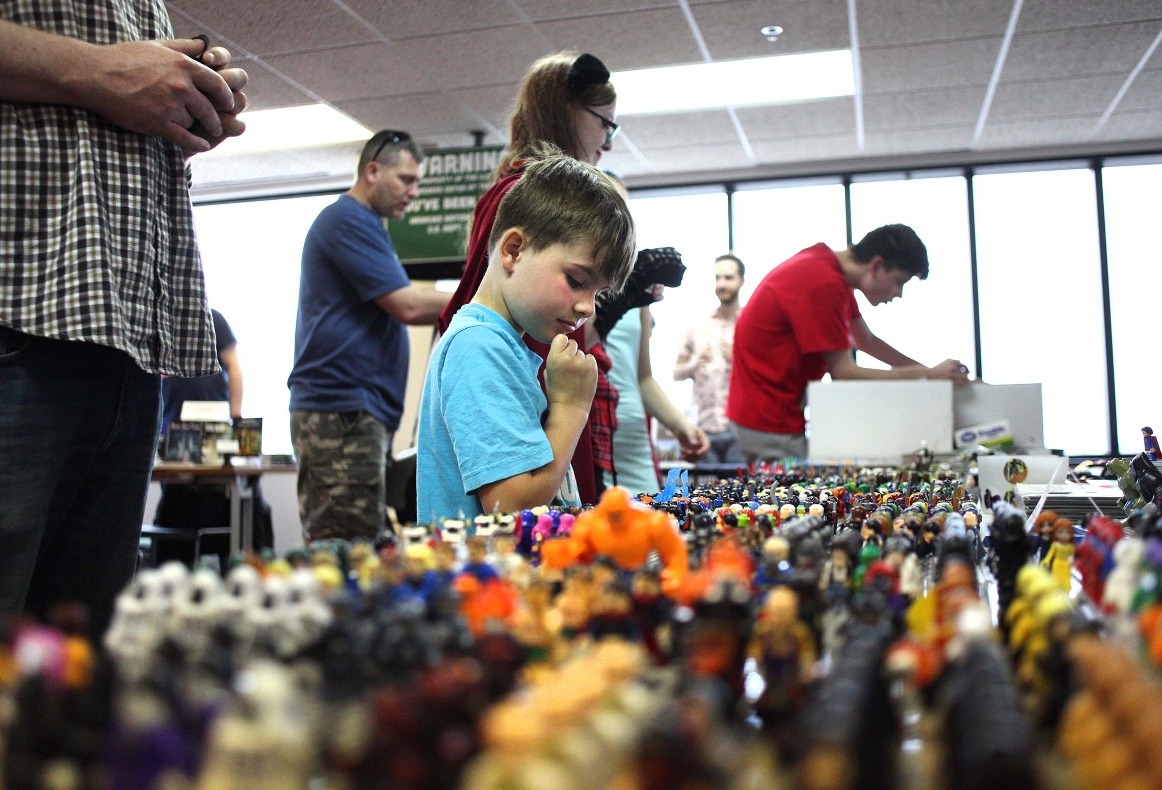  Harper Sexton, of Kankakee, makes his final lego figure choice Saturday during the 8th Annual Kankakee Fantasy Con at the Kankakee Public Library. Sexton spent a bit of time at the lego vendor booth picking the perfect figures to add to his collecti