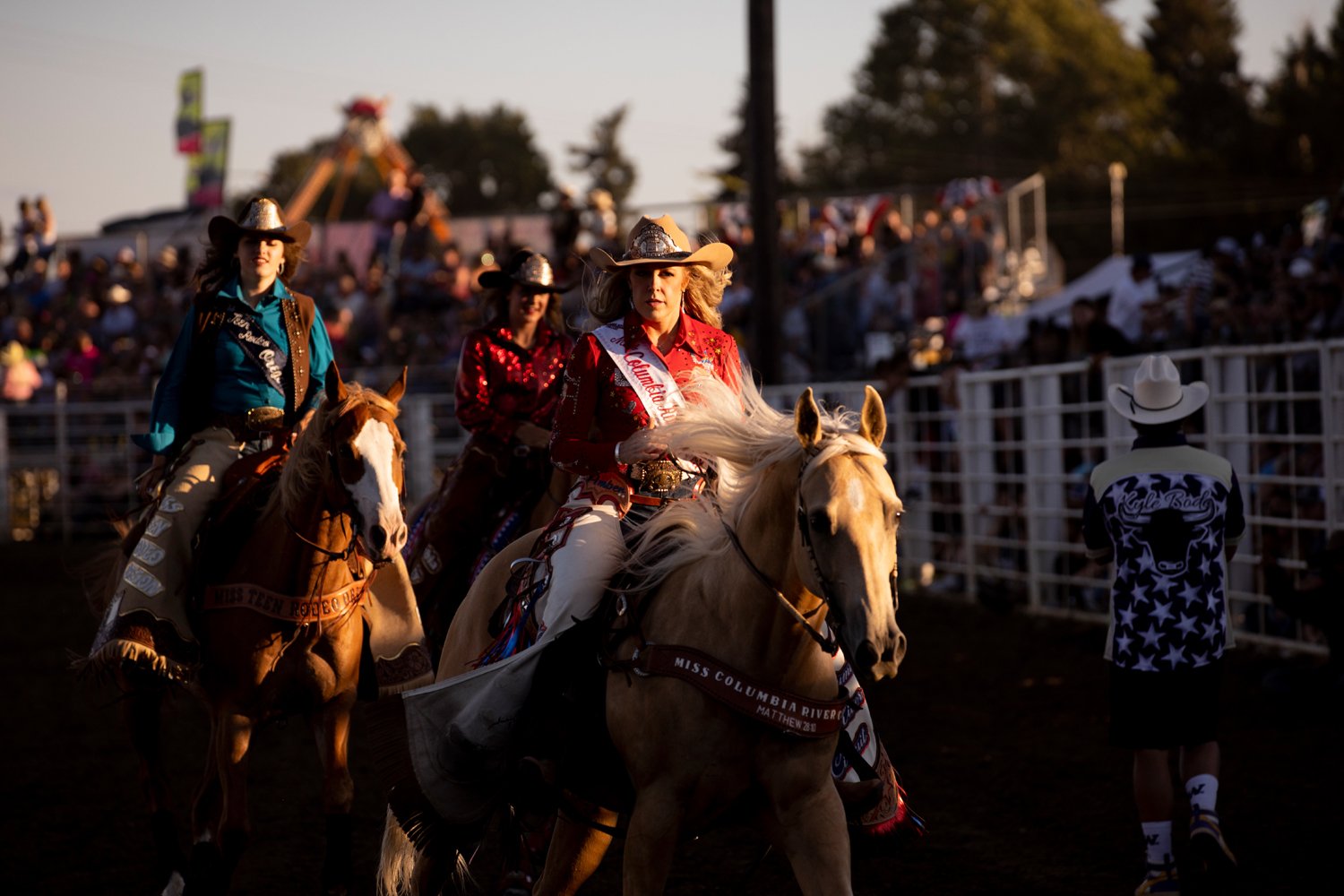  Rodeo Court members leave the area after interacting with the crowd Saturday during the Columbia County Fair and Rodeo in St Helens, Ore. 