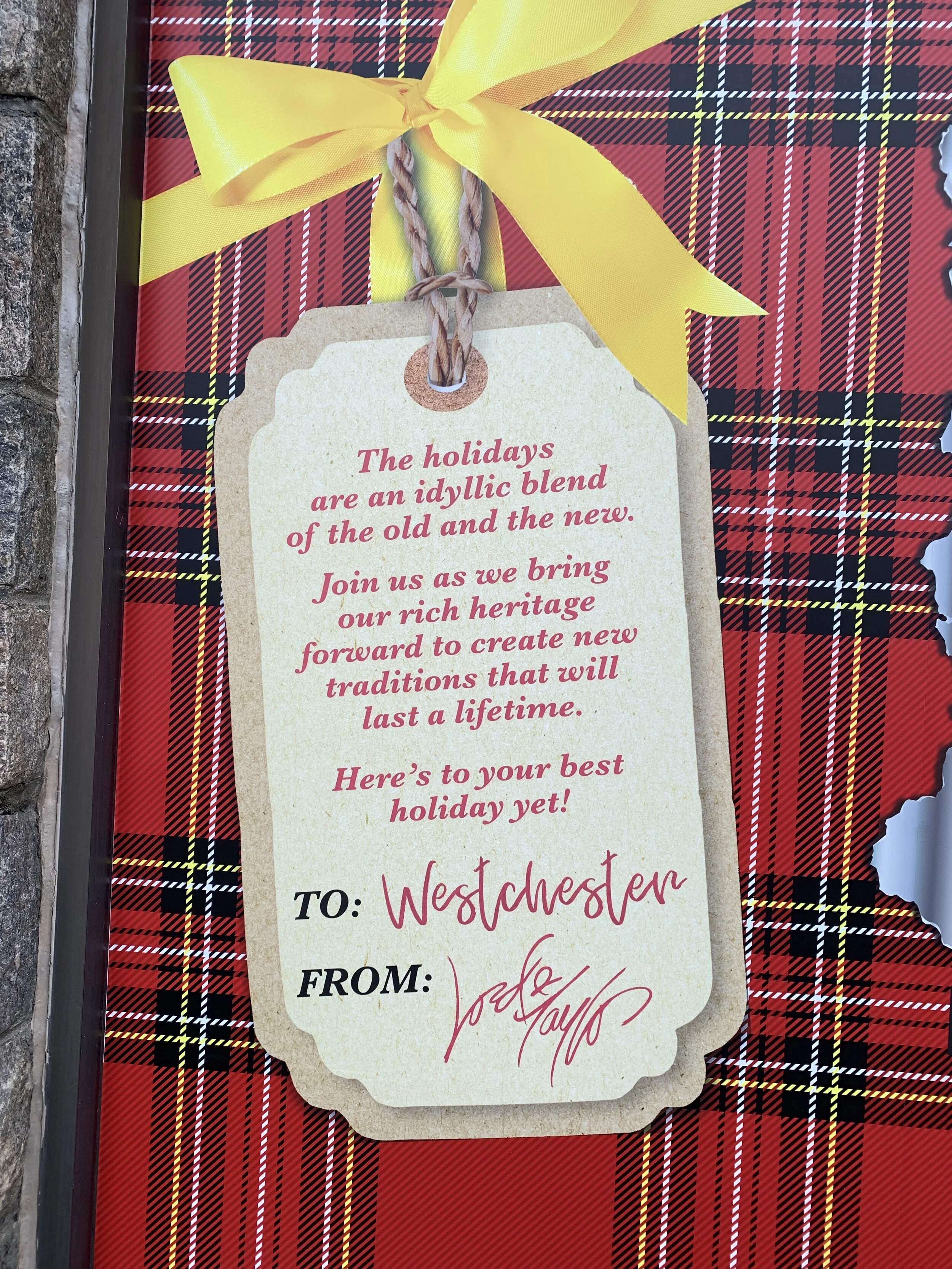 In-window sign at Eastchester/Scarsdale store