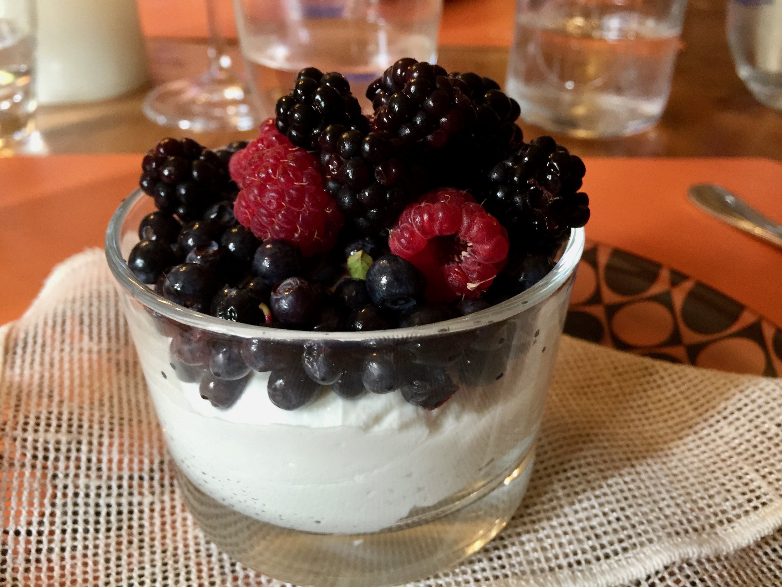 Wild summer fruits from the forest on sheep's milk ricotta that is made right around the corner in the hills of the Garfagnana.
