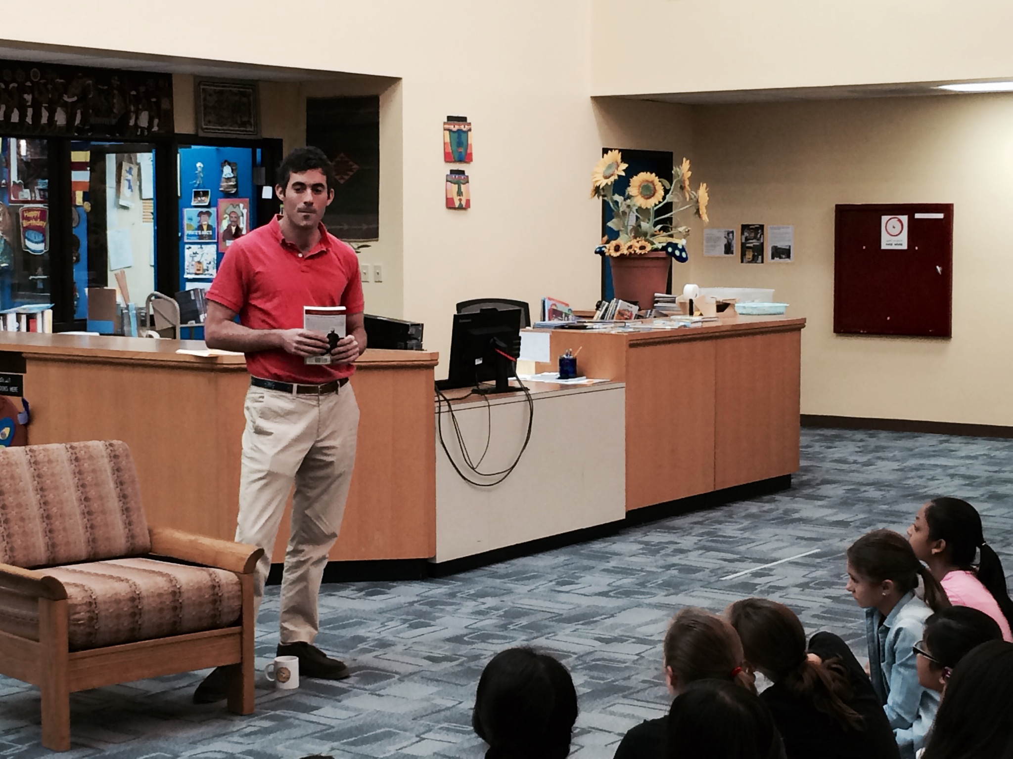 Oliver Horovitz speaks to a group of ‘Udhailiyah youngsters during his recent stop in the Southern Area community. Photo by Josh Olson