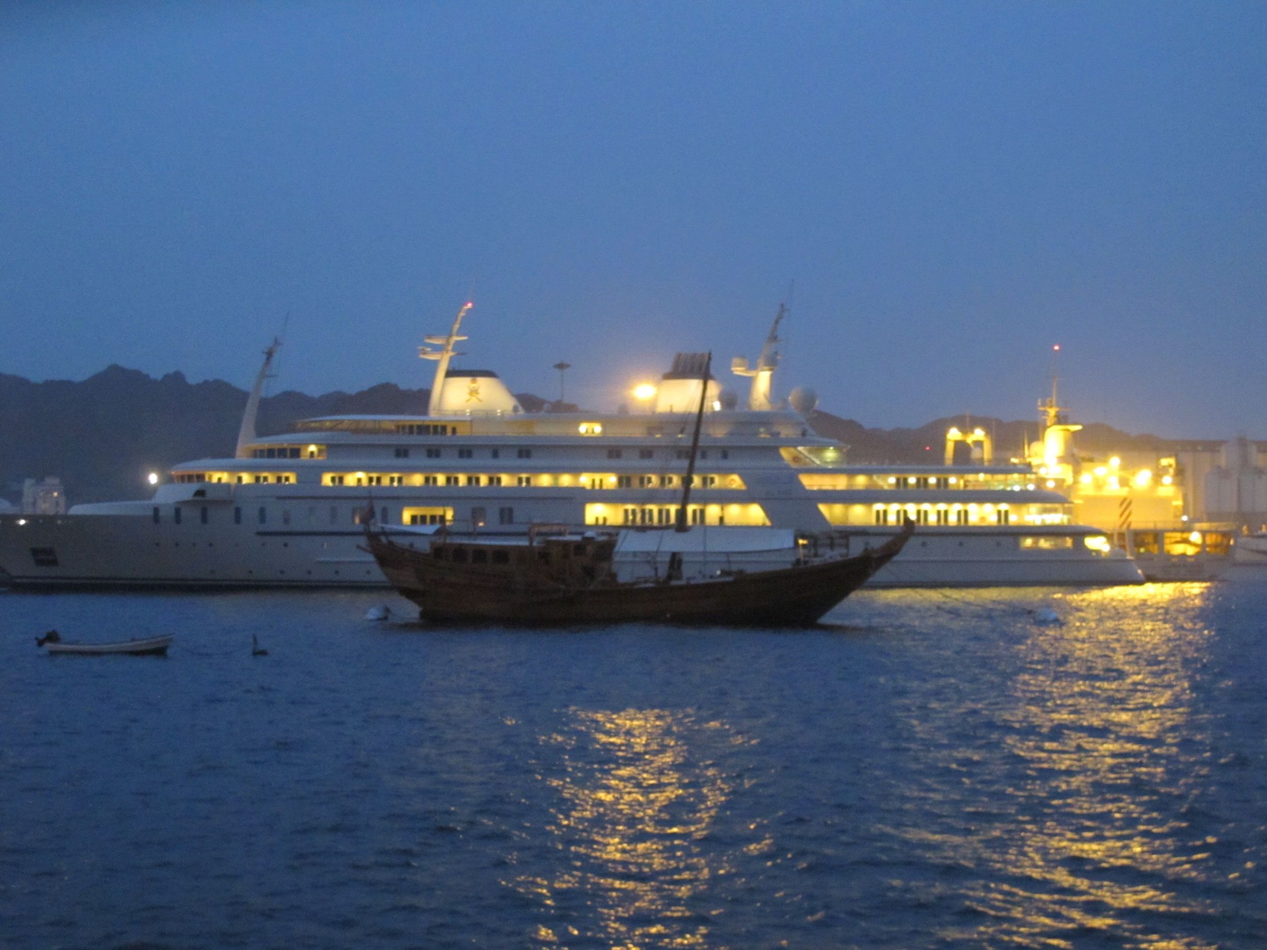 A dhow and a yacht in the harbor