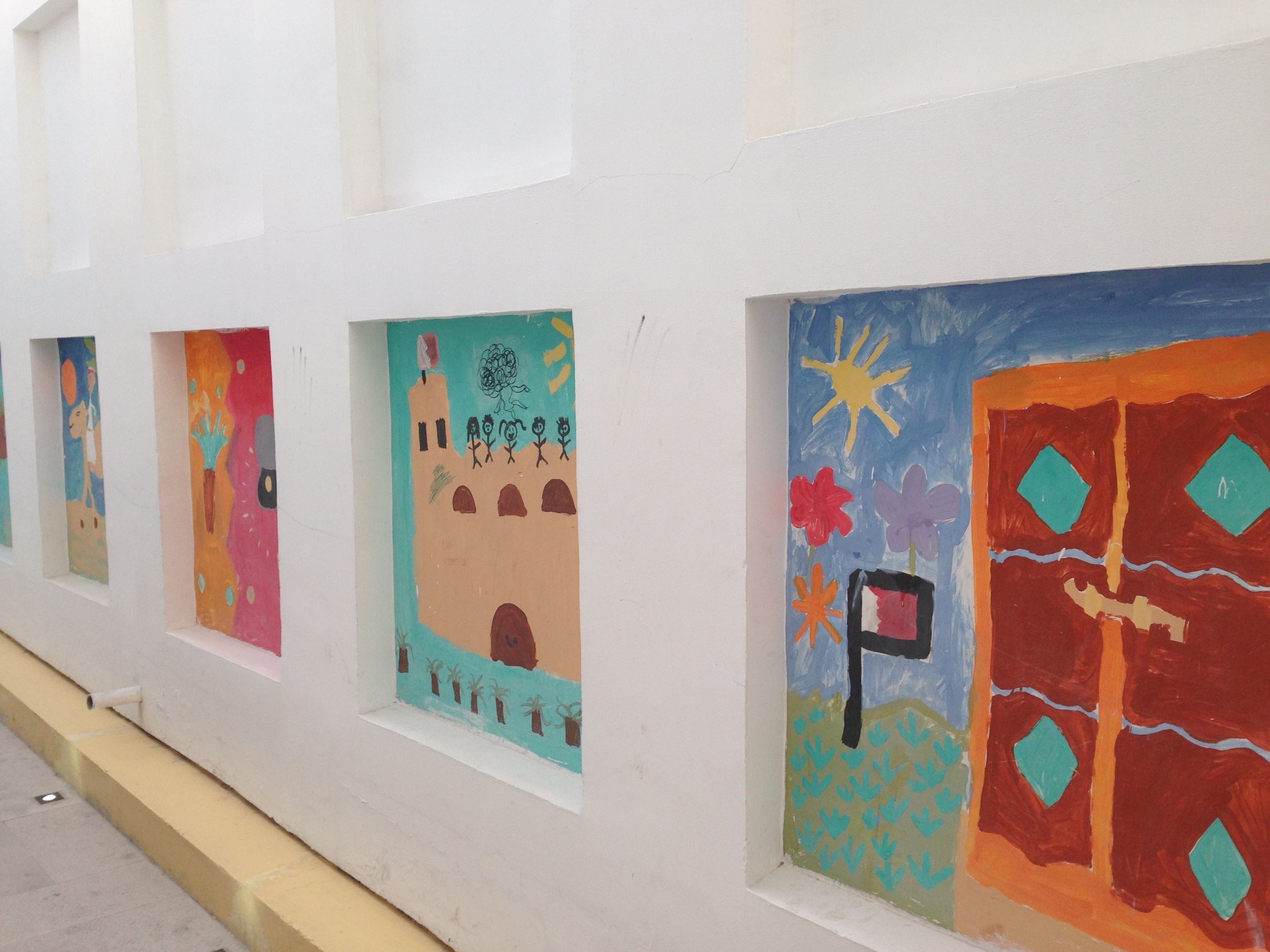 Murals (like this large-scale children's project) brightened up several walls that would otherwise have been stark white. 