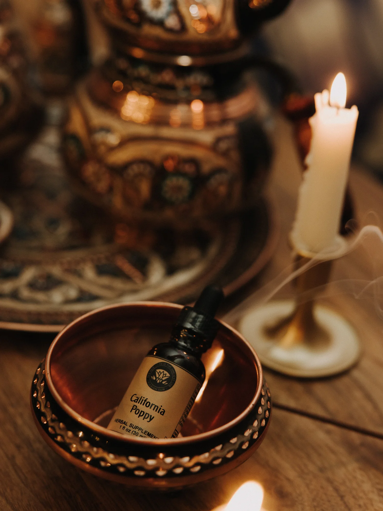 California Poppy herbal extract in copper bowl