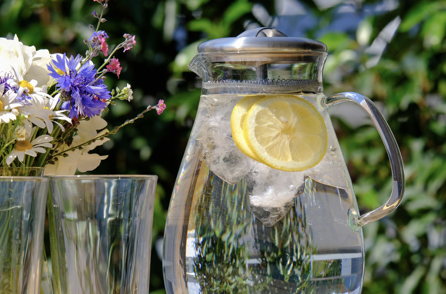 Glass pitcher of lemon water