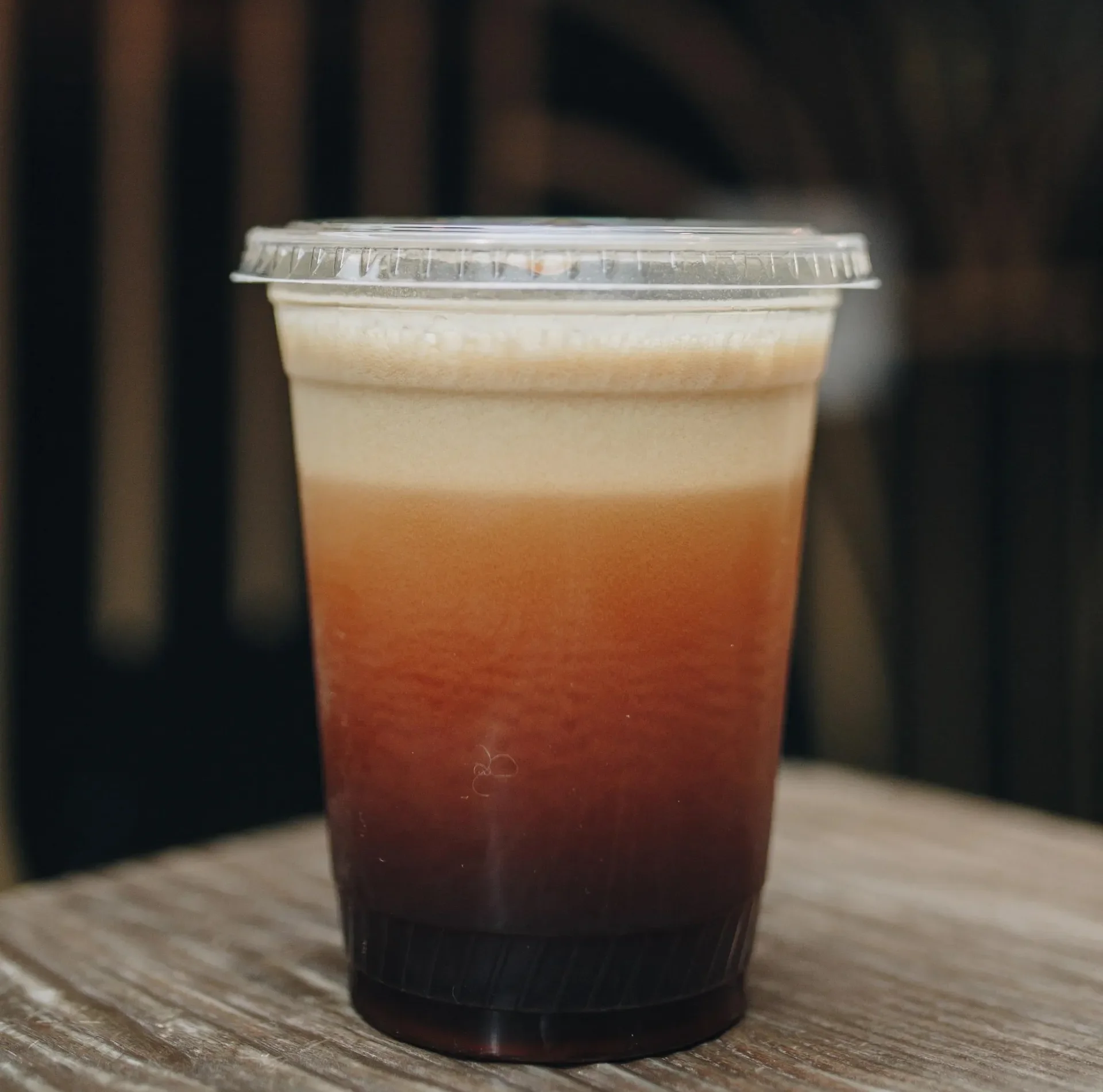 A freshly poured Aerocano featuring layers of smooth whipped espresso over sparkling water. This Raleigh Raw classic delivers a bold, refreshing coffee experience with natural energy and clean, simple ingredients.