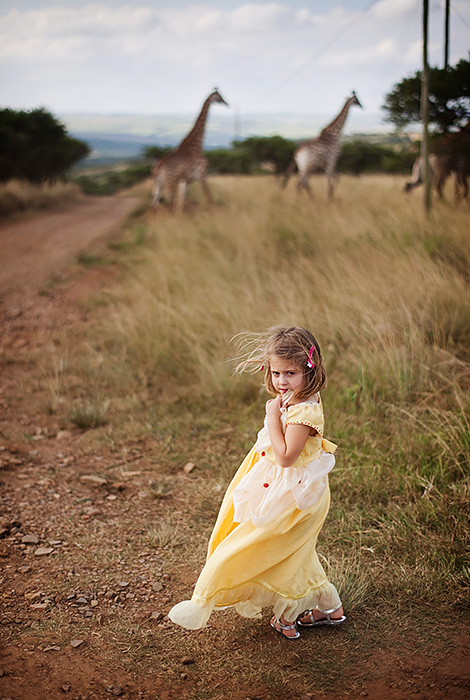 Still one of my favorite portraits of my daughter Kate made to date (even though she is WAY beyond the "Princess stage". Shot in Africa (while visiting family) we were at a game reserve and those are giraffes in the distance. Shot with the Zeiss 50mm f1.4 again at f2 there's the right amount of sharpness and out of focus elements to give the photograph an interesting look. I call this one "Beauty and the Beasts" and it's even more special because her Granny Moira handmade the Belle dress for her. 