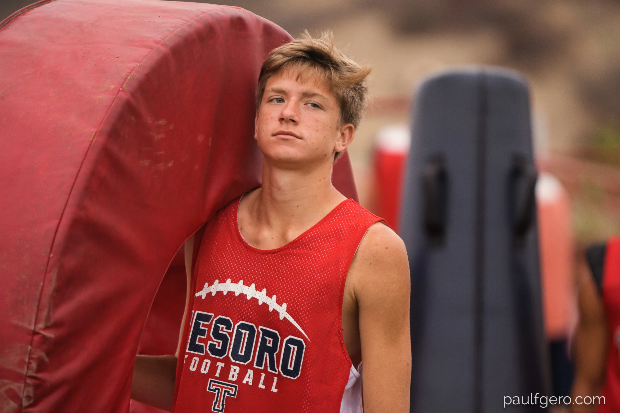 A Tesoro player helps set up the field on Day One of Fall Camp at the school on Monday. 200mm, 250 ISO, 1/500th at f2.8.