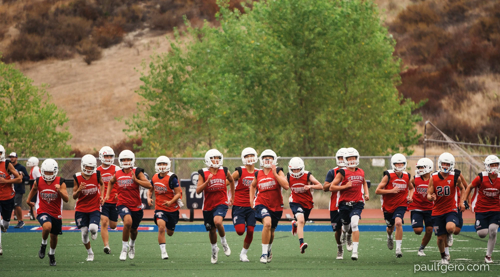 Tesoro players run during Day One of Fall Camp at the school on Monday. 200mm, 400 ISO, 1/100 0th at f2.8.