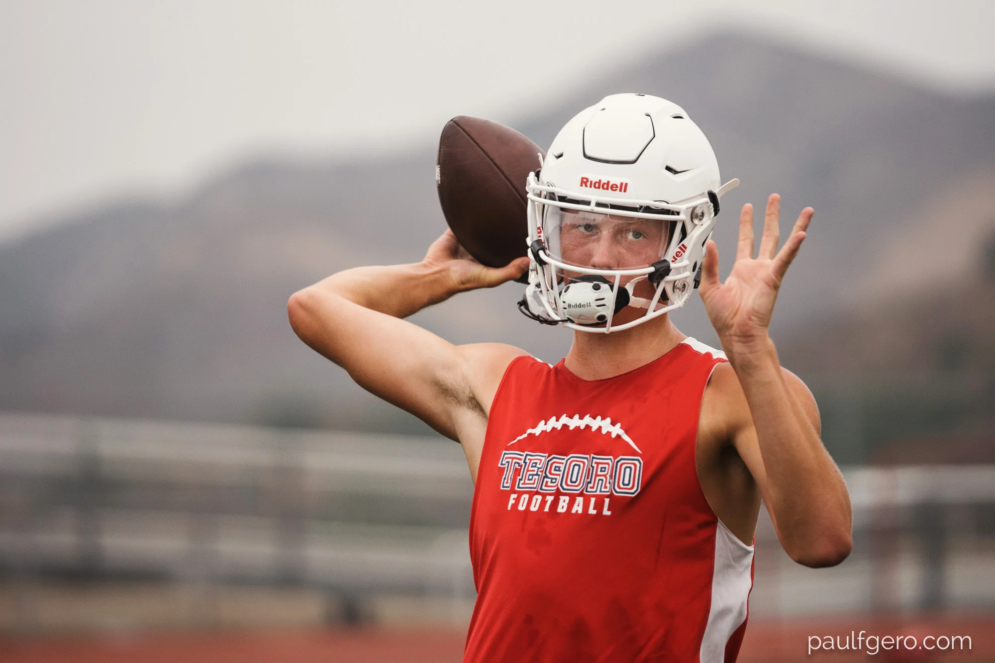 Tesoro QB Chase Petersen warms up during Day One of Fall Camp at the school on Monday. Petersen, a transfer to the school, hopes to replace Devon Modster at QB who graduated and now plays for UCLA. 200mm, 400 ISO, 1/100 0th at f2.8.