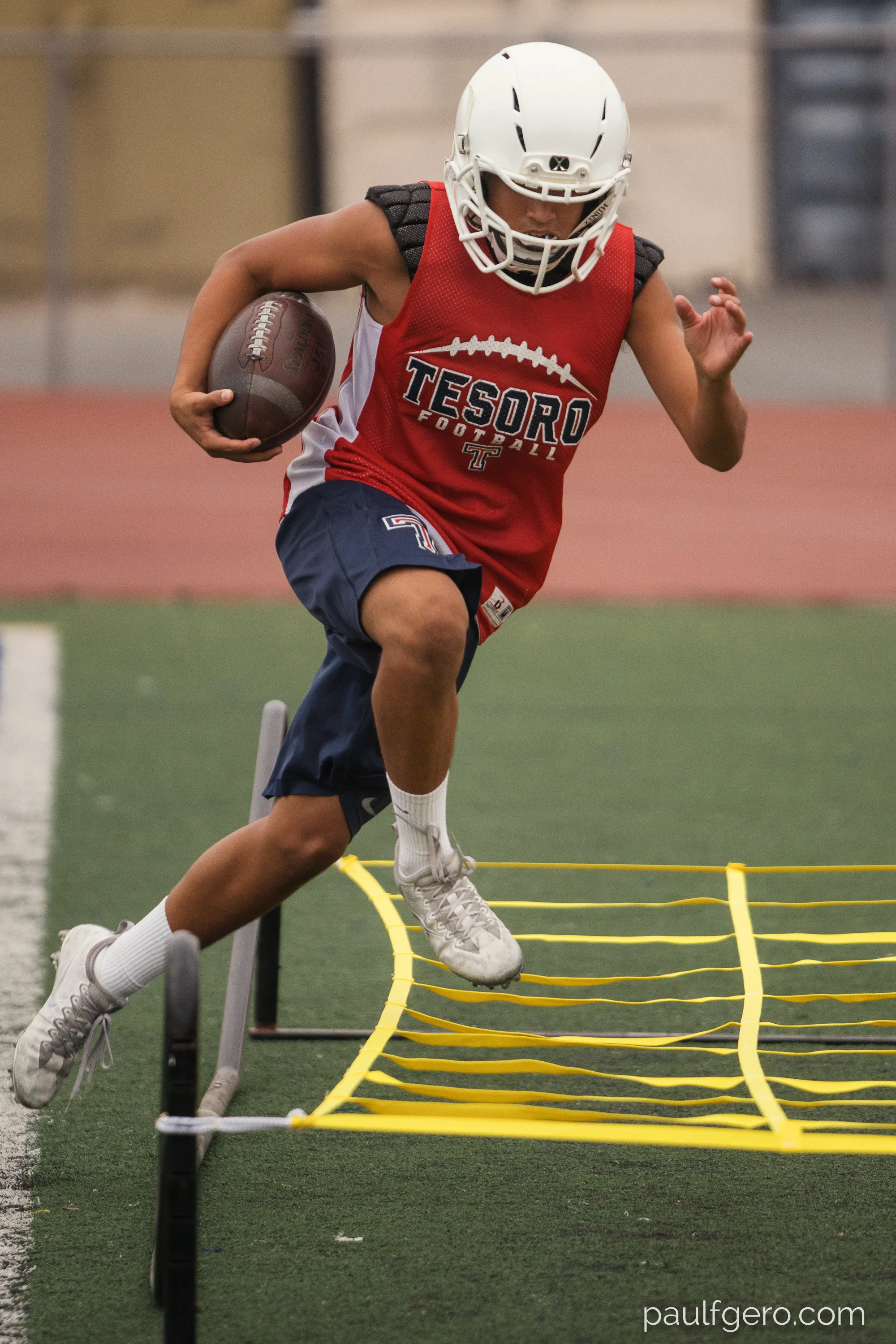 A Tesoro player does agility drills during Day One of Fall Camp at the school on Monday. 200mm, 400 ISO, 1/100 0th at f2.8.