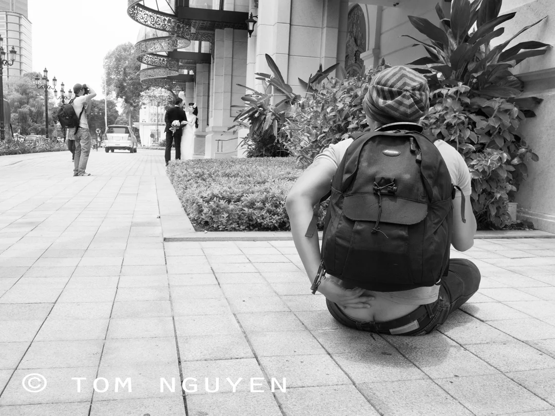 Olympus E-PL5 + Panasonic 14mm/2.5 pancake lens. After I took this photo, the photographer's assistant yelled to him (in Vietnamese), "HAHA he's taking a picture of your butt crack!!" I then ran.