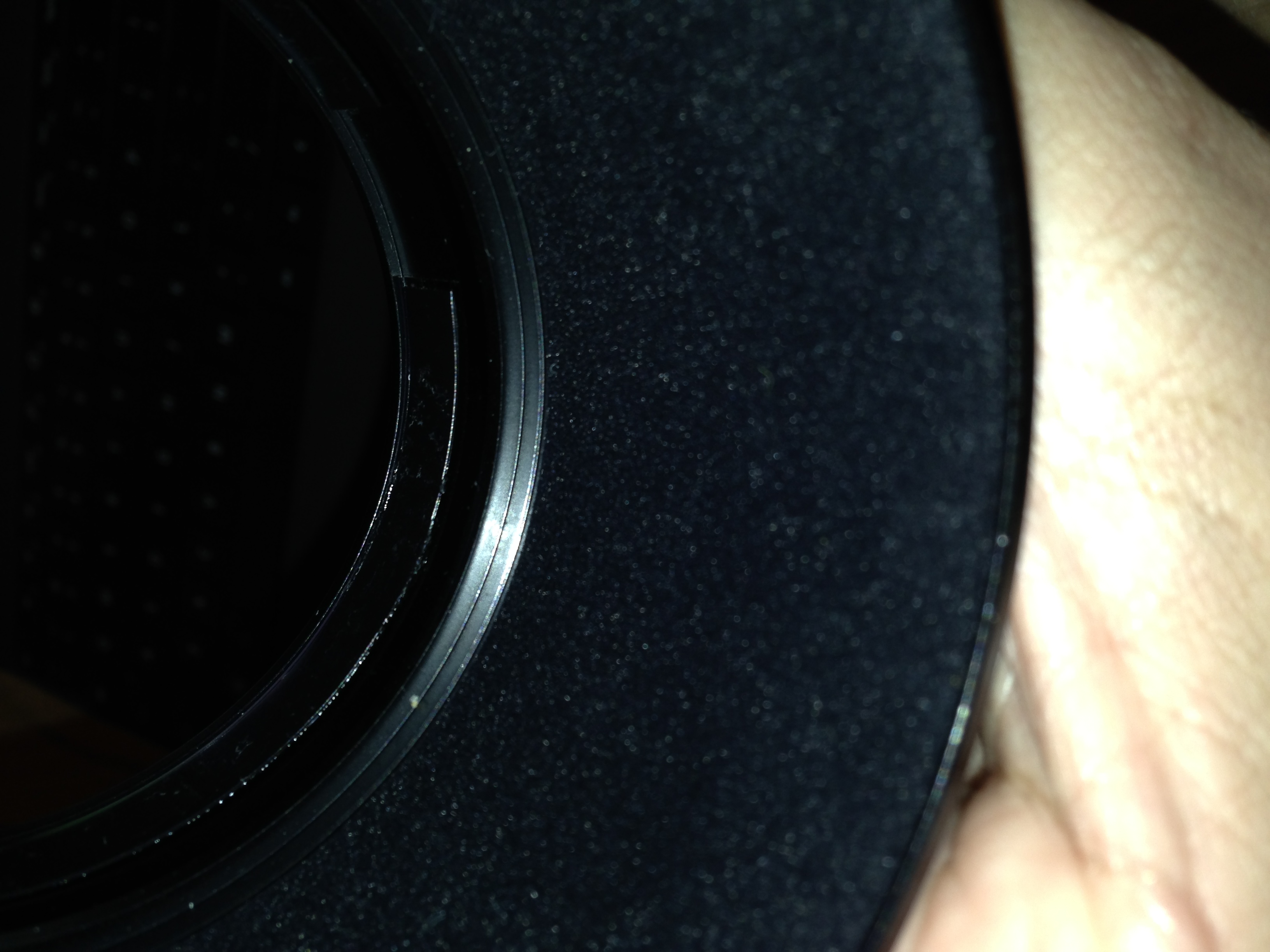 Inside the lens hood. You can see the tightening ring at the rear.