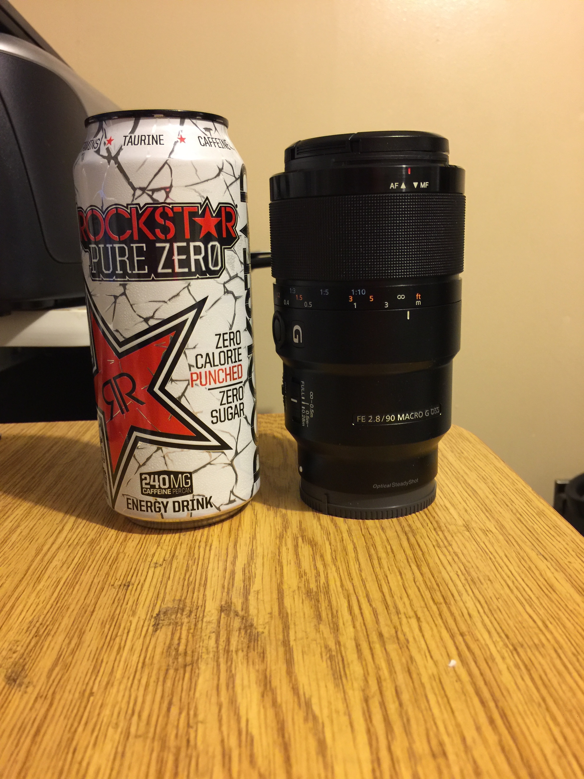The 90mm/2.8 macro lens is a little shorter and a little thicker than my Rockstar energy drink. Definitely heavier!