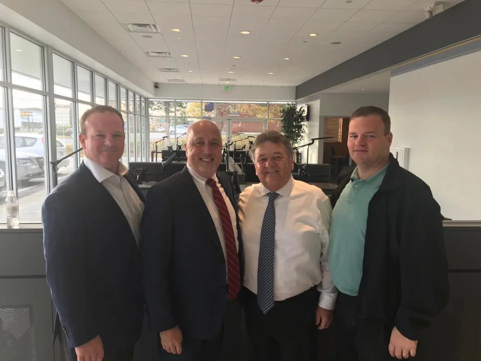 Mark Brewster, Brockton Mayor Bill Carpenter, George Brewster Sr. and George Brewster Jr. at the new Brockton Main Street location.