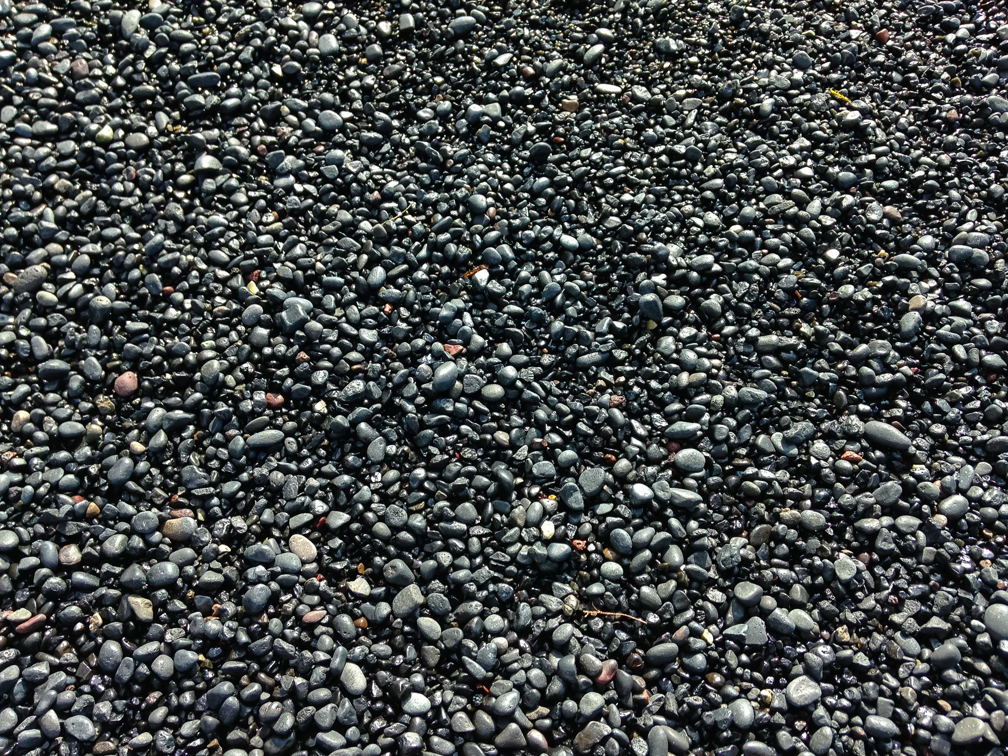 A beach made of small smooth pebbles