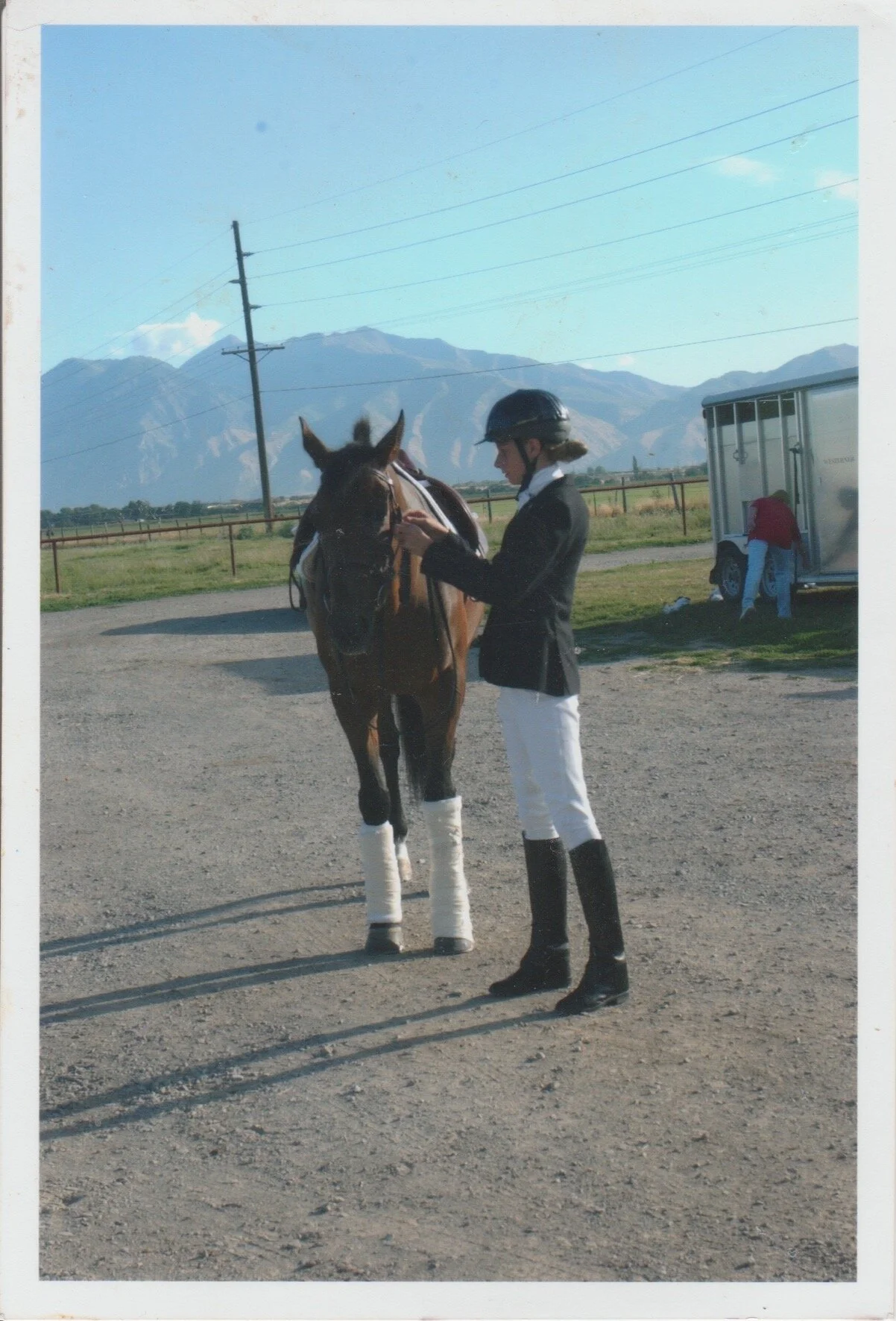 With my leased thoroughbred, Scout, making final preparations before the rating. P.S. I have NO IDEA what is happening with his mane!
