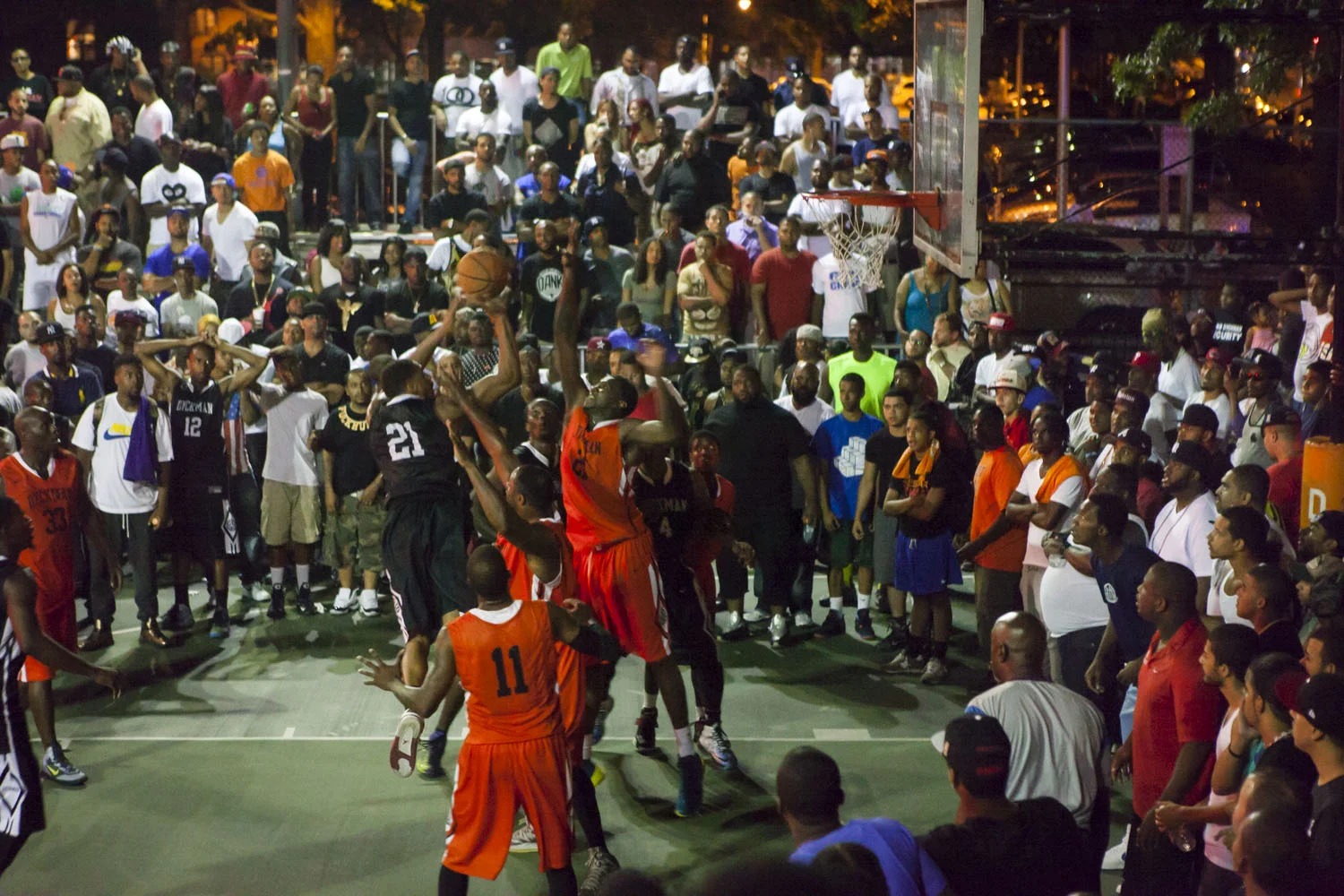 Mike "Optimus Prime" Glover drives to the bucket and makes a difficult shot over two defenders look routine . 